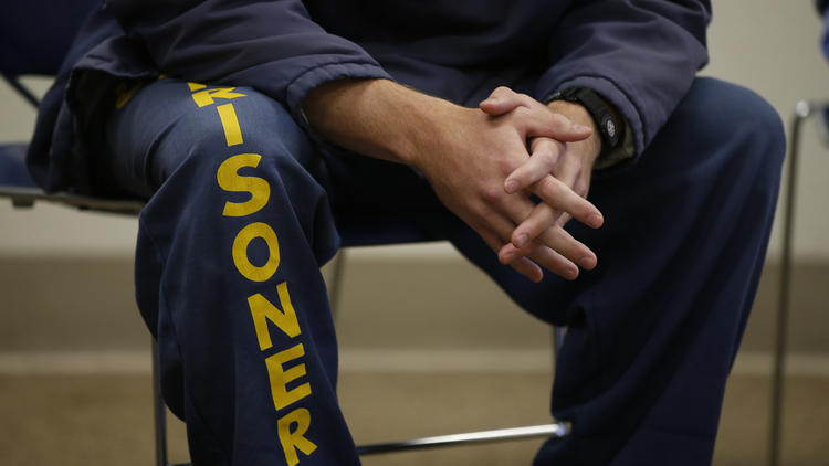 An inmate in the Offender Mentor Certification Program at Solano State Prison listens during class. (Credit: Mark Boster / Los Angeles Times)