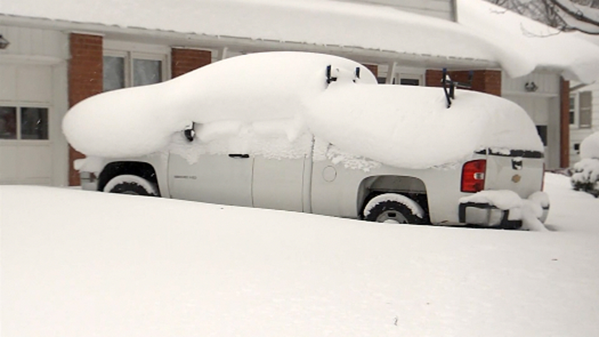 A truck is seen covered in snow in Erie, Pennsylvania. (Credit: CNN)