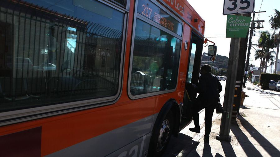 A passenger boards the Metro 217 bus on La Cienega Boulevard in a file photo. (Credit: Brian van der Brug / Los Angeles Times)