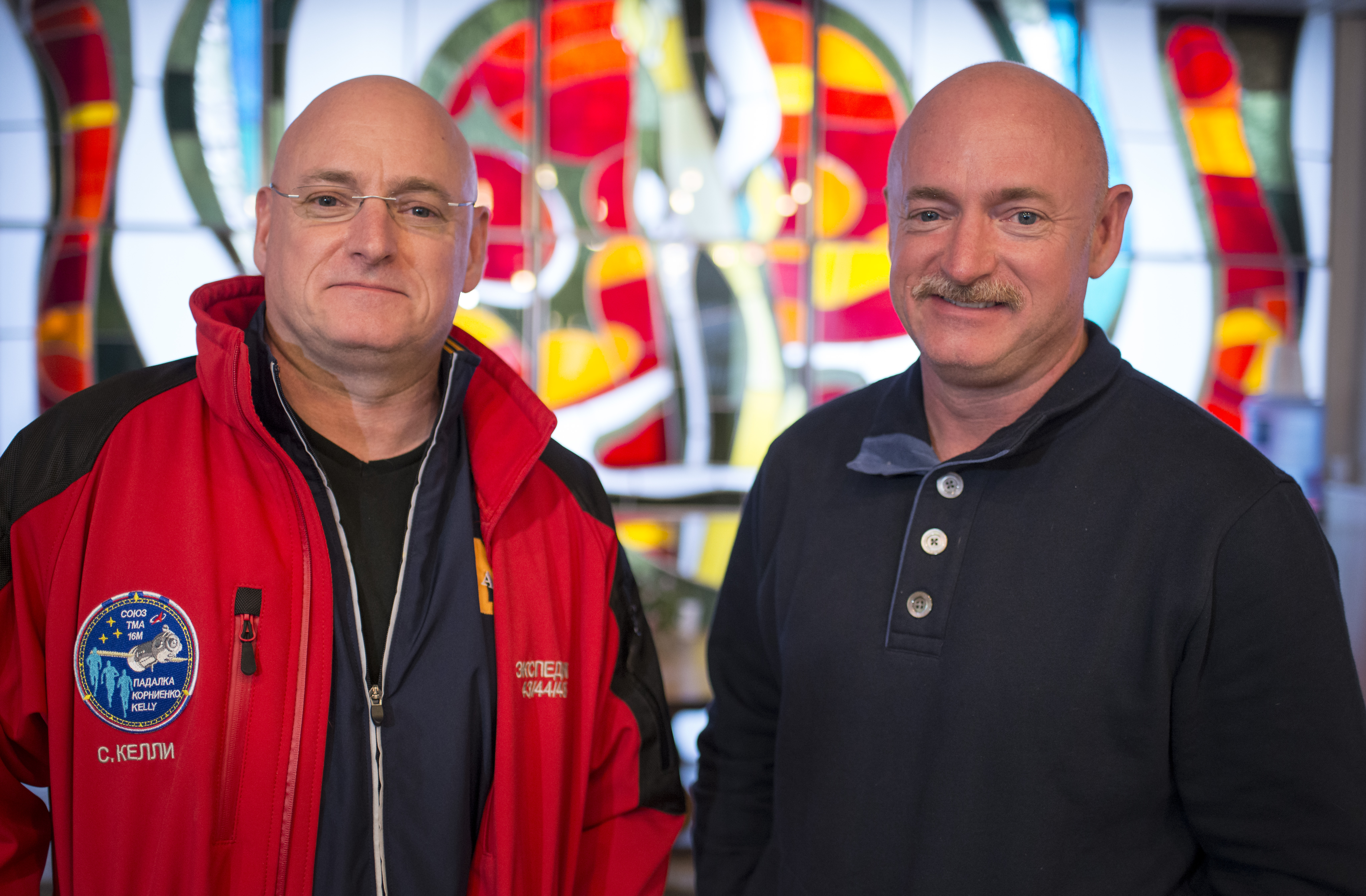 Expedition 43 NASA Astronaut Scott Kelly, left, and his identical twin brother Mark Kelly, pose for a photograph March 26, 2015, at the Cosmonaut Hotel in Baikonur, Kazakhstan. (Credit: Bill Ingalls/NASA via Getty Images)