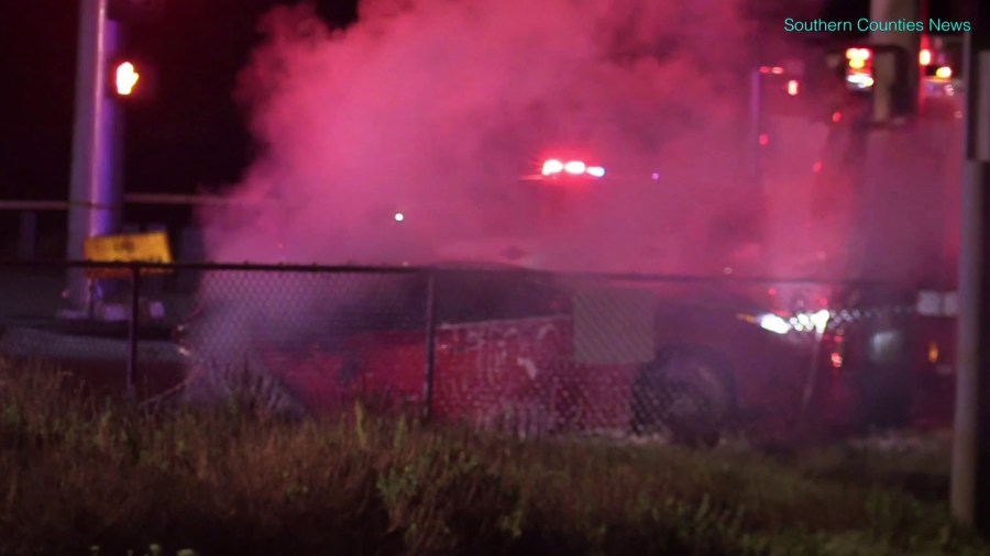 A vehicle is seen after a fiery crash on the Pacific Coast High and Magnolia Street in Huntington Beach on March 29, 2018. (Credit: Southern Counties News/KTLA)