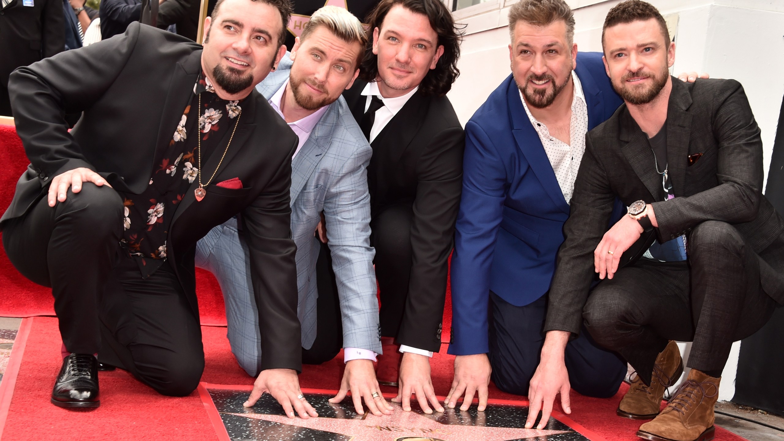 Chris Kirkpatrick, Lance Bass, JC Chasez, Joey Fatone and Justin Timberlake of *NSYNC are honored with a star on the Hollywood Walk of Fame on April 30, 2018. (Alberto E. Rodriguez/Getty Images)