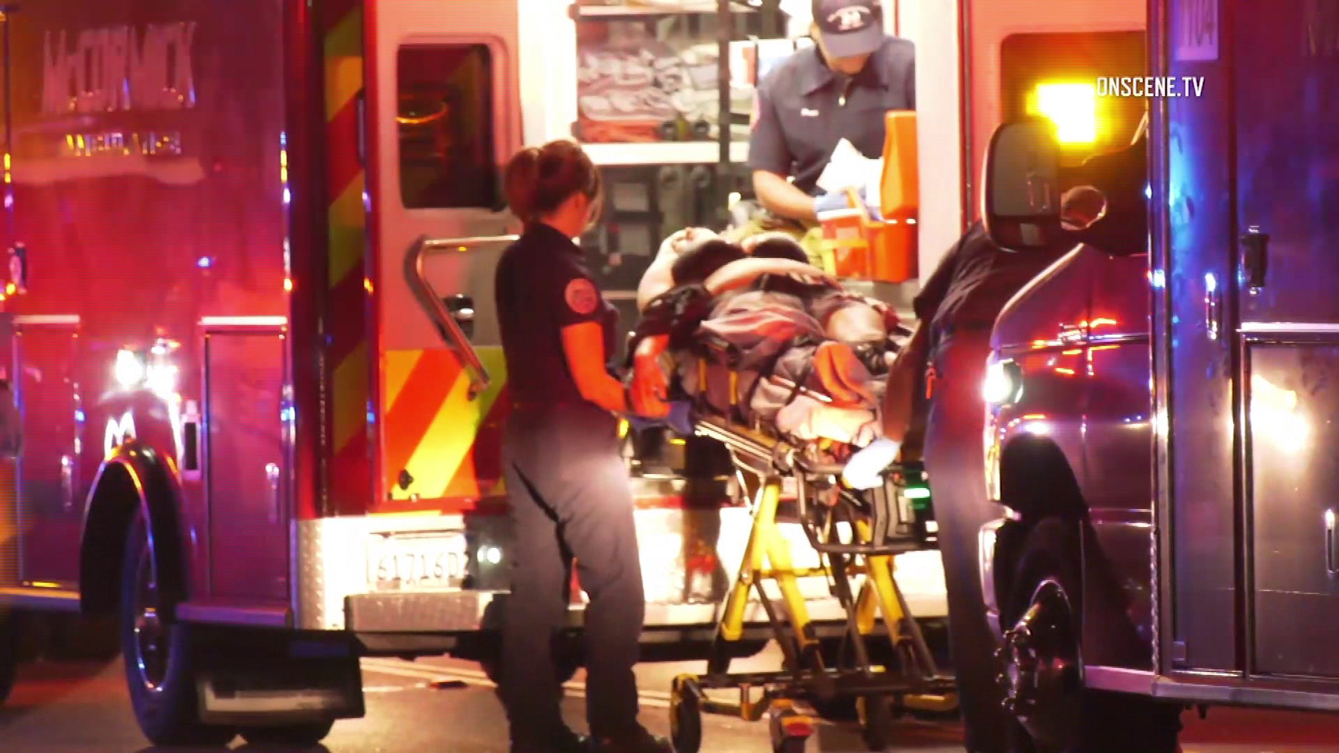 A victim is loaded into an ambulance after four people were shot at a party in Gardena on July 31, 2018. (Credit: OnScene.TV)