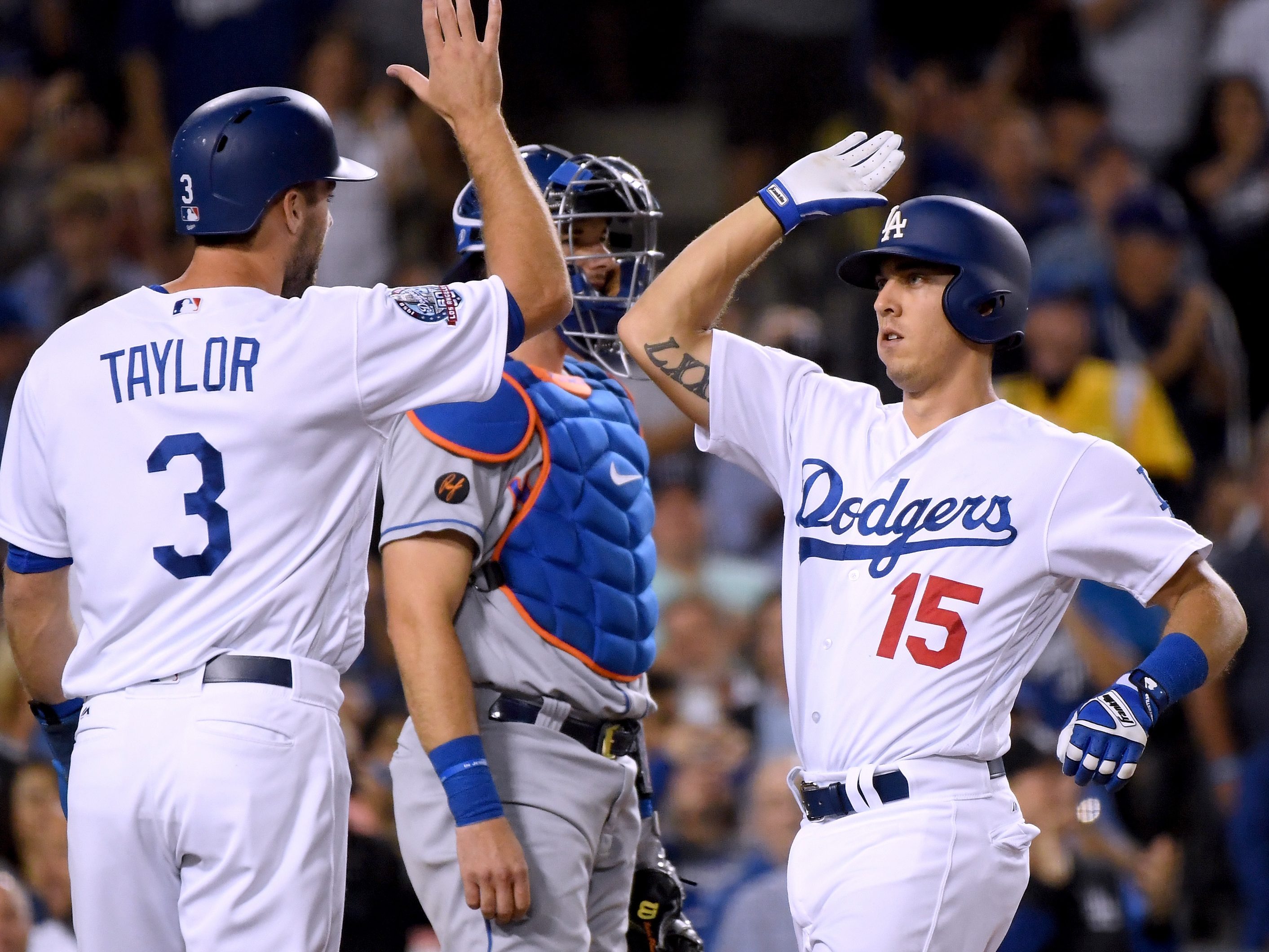 Austin Barnes of the Los Angeles Dodgers celebrates his two-run homerun against the New York Mets with Chris Taylor during the third inning at Dodger Stadium on Sept. 4, 2018. (Credit: Harry How / Getty Images)