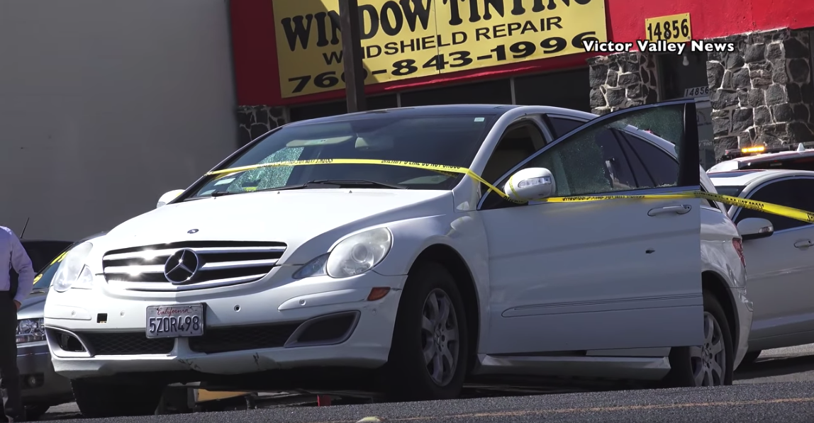 A Mercedes-Benz hatchback is taped off at the scene where San Bernardino County sheriff's deputies fatally shot a female suspect in Victorville on Oct. 2, 2018. (Credit: Victor Valley News)