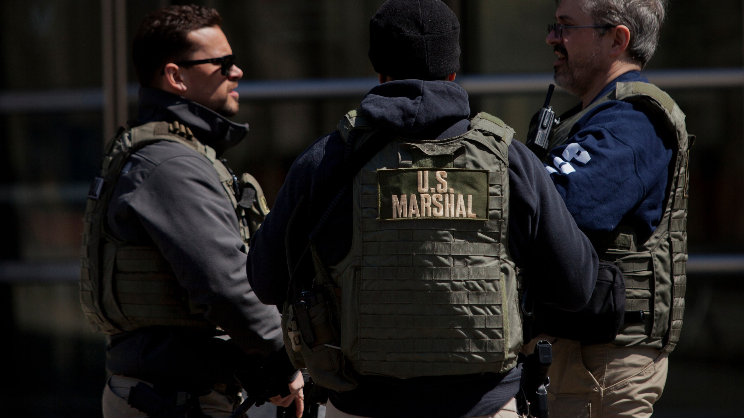 U.S. Marshals stand outside U.S. Federal Court in Brooklyn during the arraignment on a case involving terrorist charges on April 2, 2015. (Credit: Victor J. Blue/Getty Images)