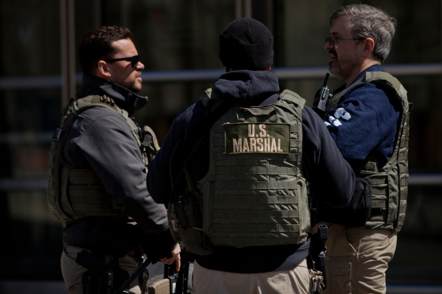 U.S. Marshals stand outside U.S. Federal Court in Brooklyn during the arraignment on a case involving terrorist charges on April 2, 2015. (Credit: Victor J. Blue/Getty Images)
