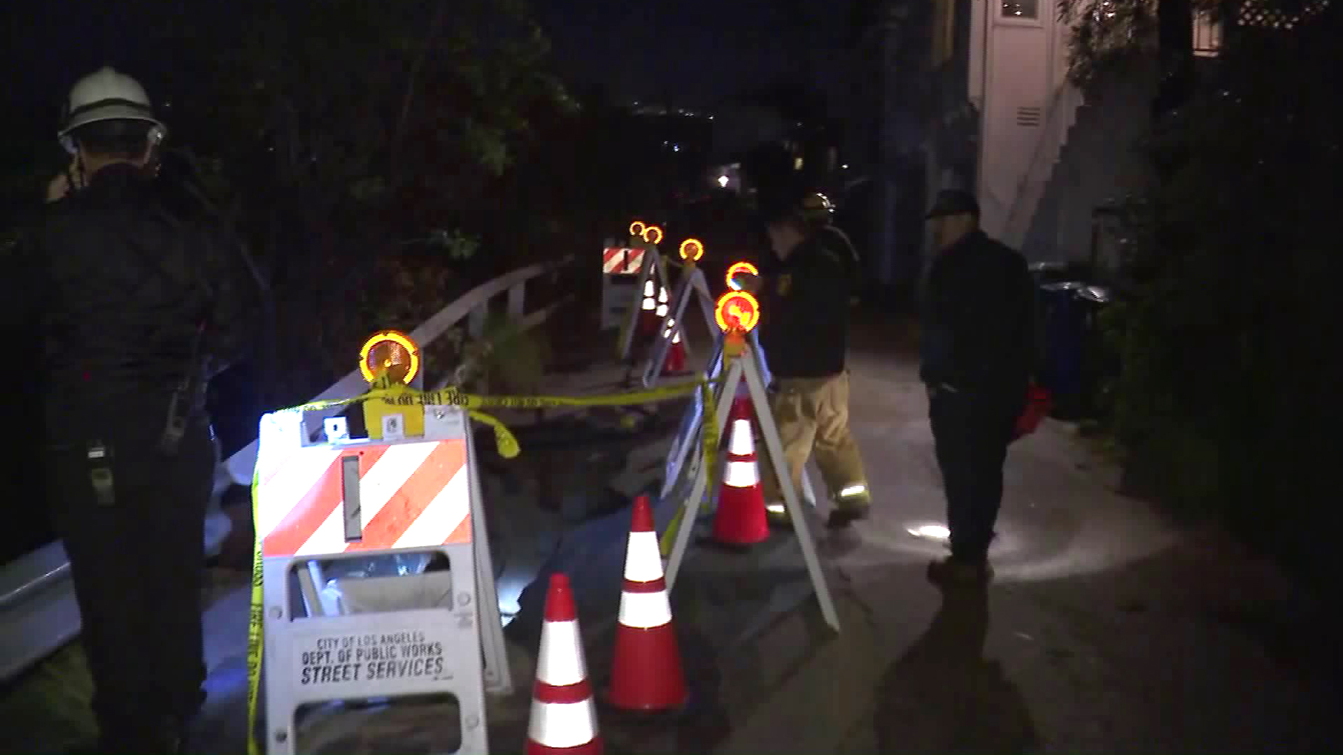 Fire officials respond after a portion of Mannix Drive collapsed in Laurel Canyon and the hillside underneath slid down on Jan. 17, 2019. (Credit: KTLA)