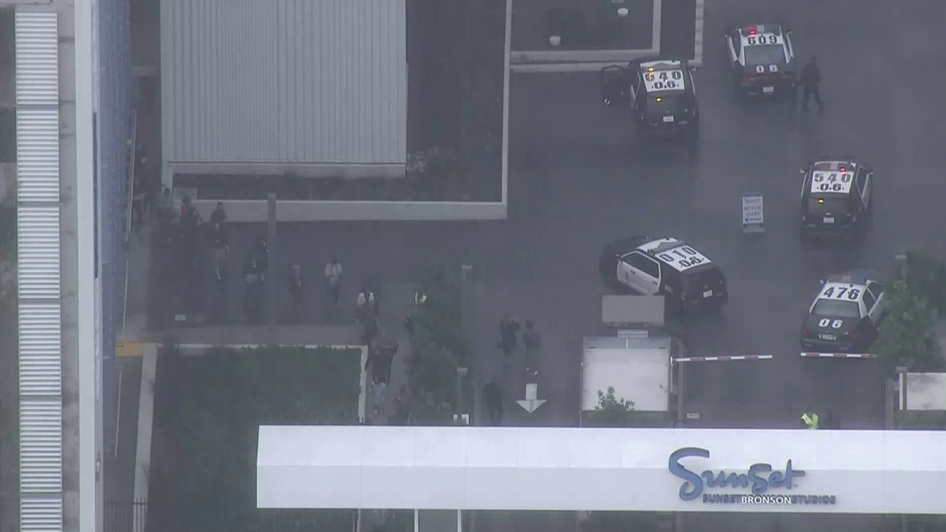 Employees are led out of Netflix's Cue building on the Sunset Bronson Studios lot in Hollywood on Feb. 14, 2019. (Credit: KTLA)