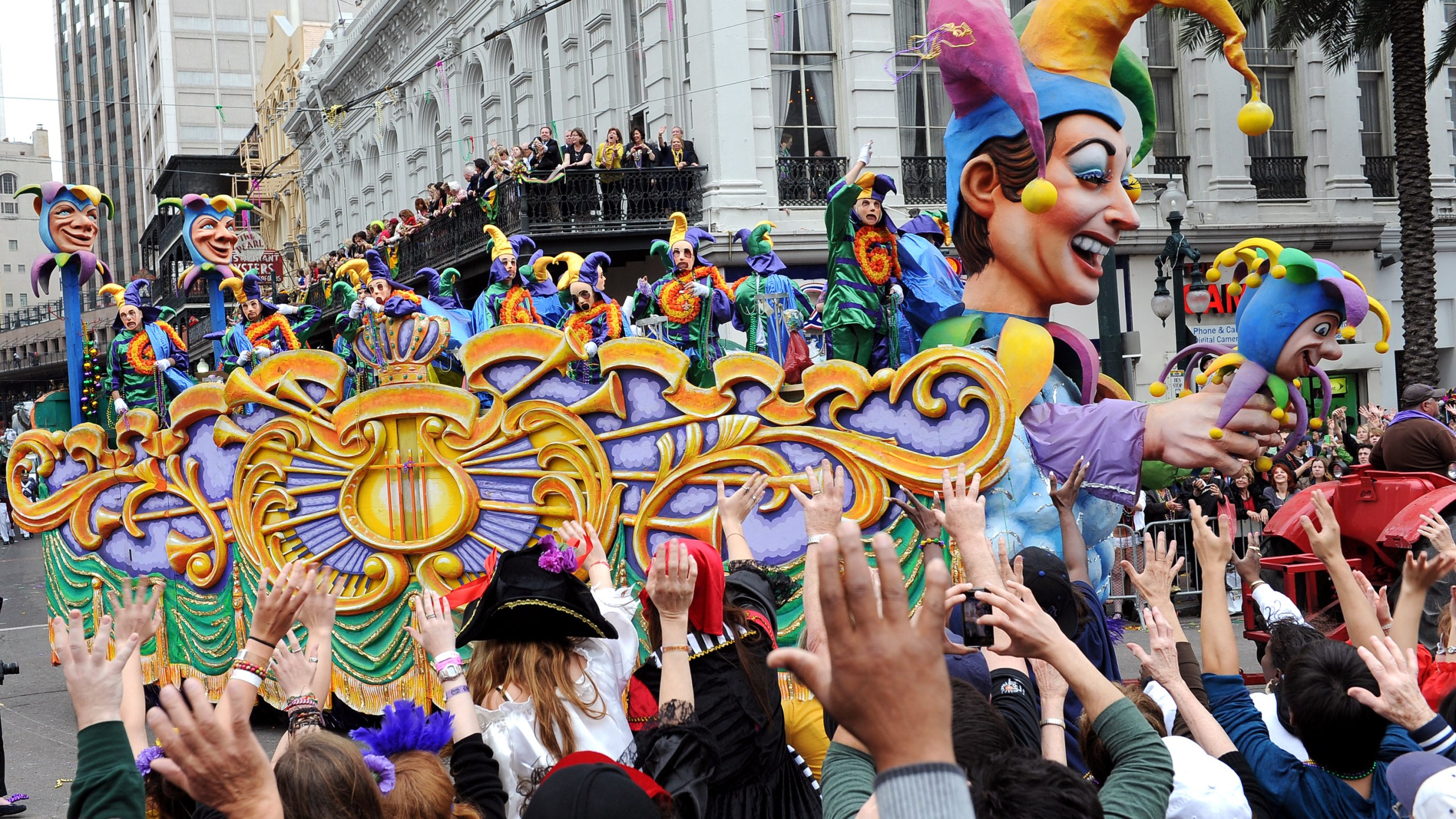 Large crowds reach up for beads as the Jester float in the traditional Rex parade rolls down Canal Street on Mardi Gras March 8, 2011 in News Orleans, Louisiana. (Credit: Cheryl Gerber/Getty Images)