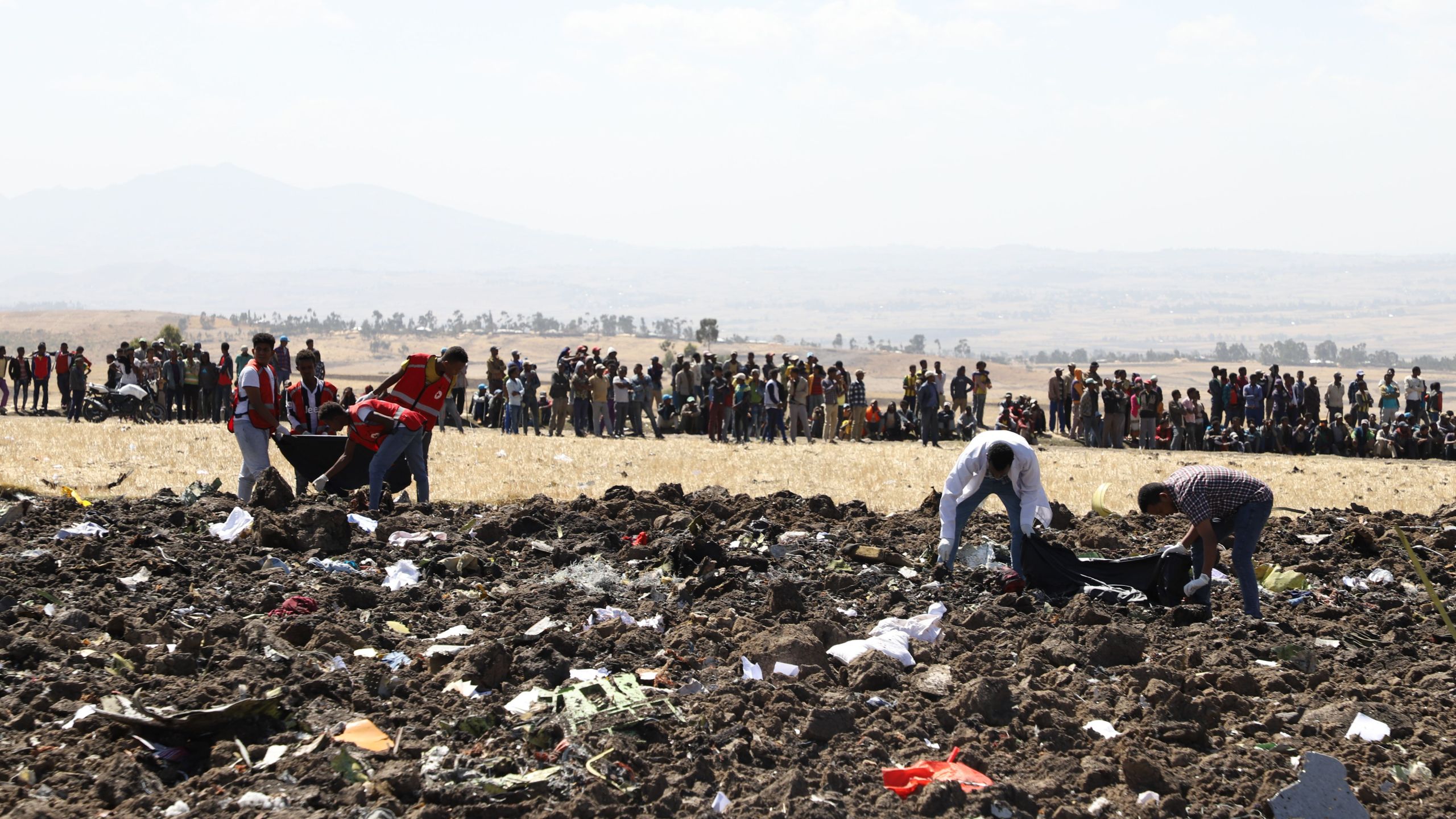 Rescue team collect remains of bodies amid debris at the crash site of Ethiopia Airlines near Bishoftu, Ethiopia, on March 10, 2019. -(Credit: MICHAEL TEWELDE/AFP/Getty Images)