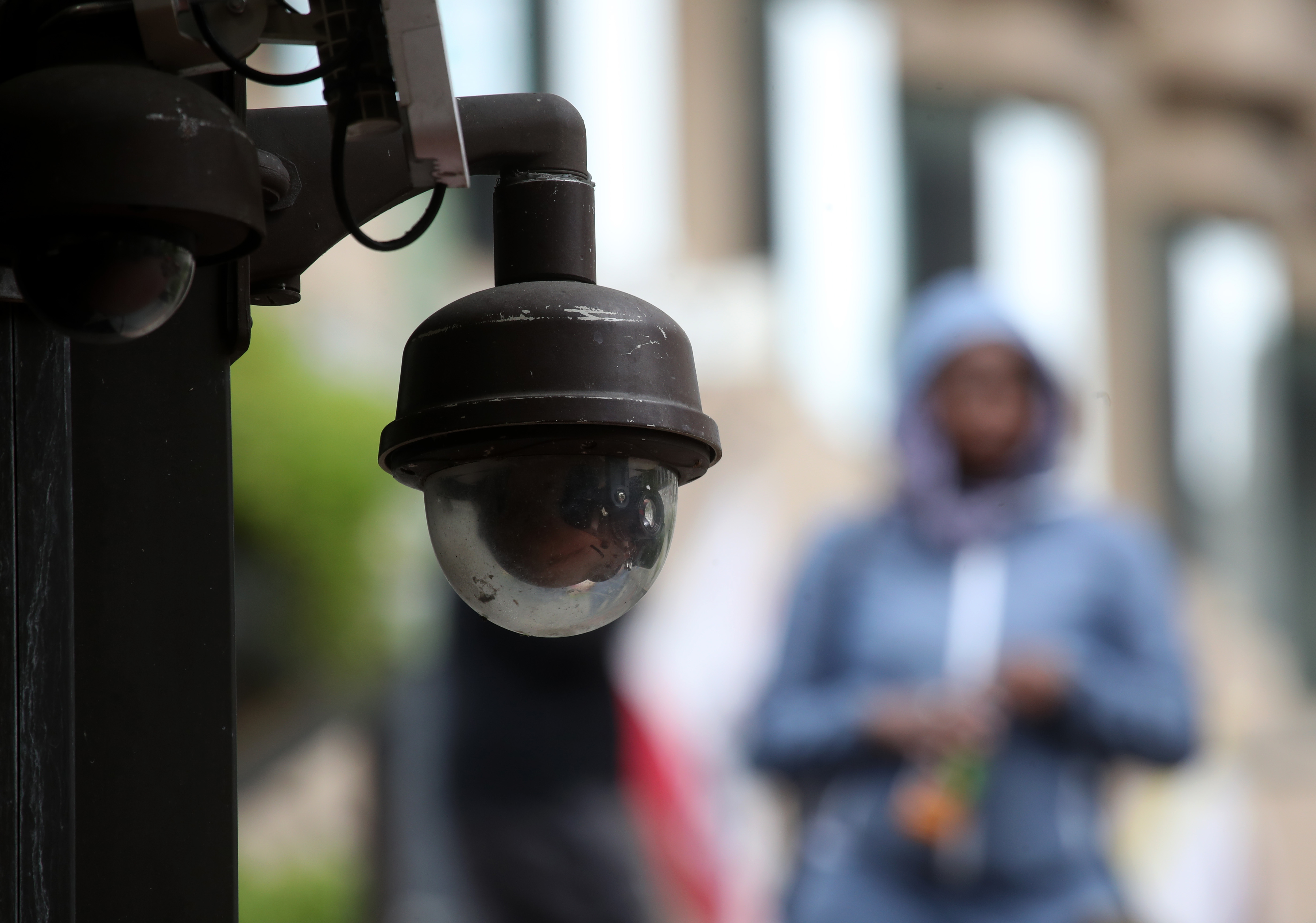 A video surveillance camera hangs from the side of a building in San Francisco on May 14, 2019. (Credit: Justin Sullivan / Getty Images)