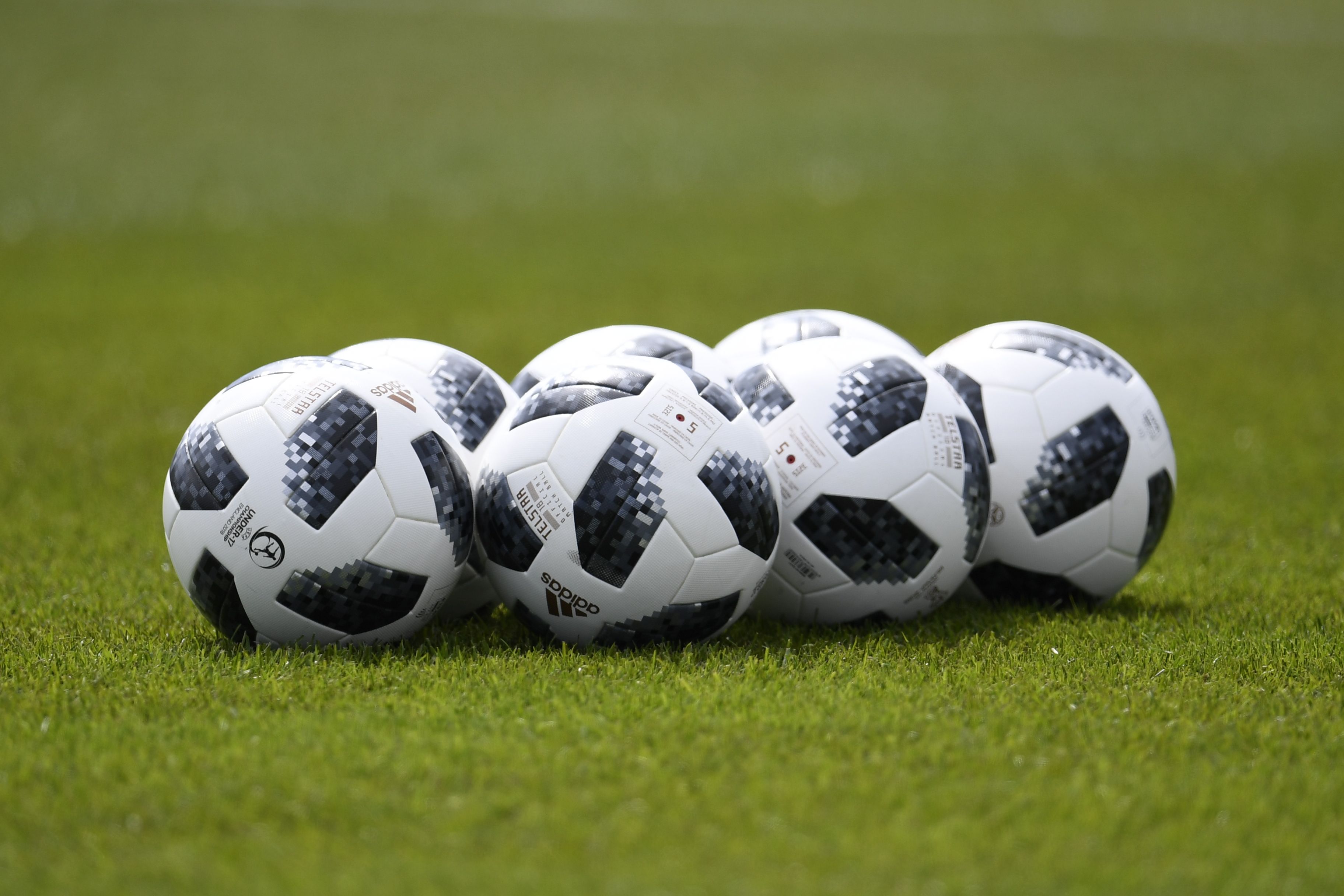 This filephoto shows soccer balls on a field in Zelenogorsk on June 13, 2018. (Credit: CHRISTOPHE SIMON/AFP/Getty Images)