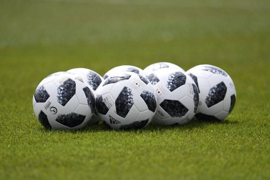 This filephoto shows soccer balls on a field in Zelenogorsk on June 13, 2018. (Credit: CHRISTOPHE SIMON/AFP/Getty Images)