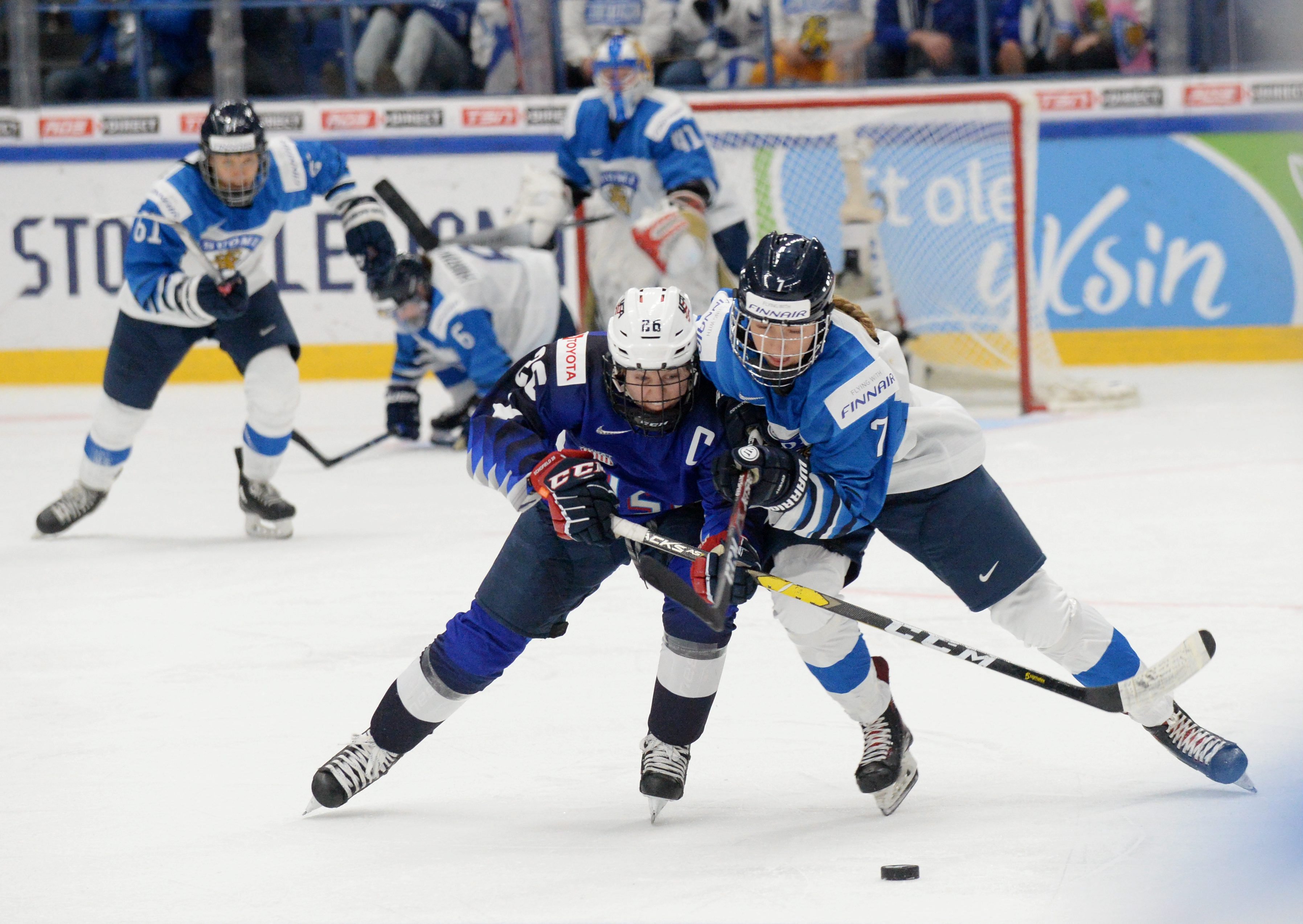 Kendall Coyne Schofield (L) of the United States and Nelli Laitinen of Finland vie during the IIHF Women's Ice Hockey World Championships final match between the United States and Finland in Espoo, Finland, on April 14, 2019. (Credit: MIKKO STIG/AFP/Getty Images)
