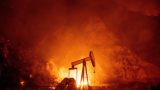 Flames from the Maria Fire burn through an oil field in Santa Paula on Oct. 31, 2019. (Credit: JOSH EDELSON/AFP via Getty Images)