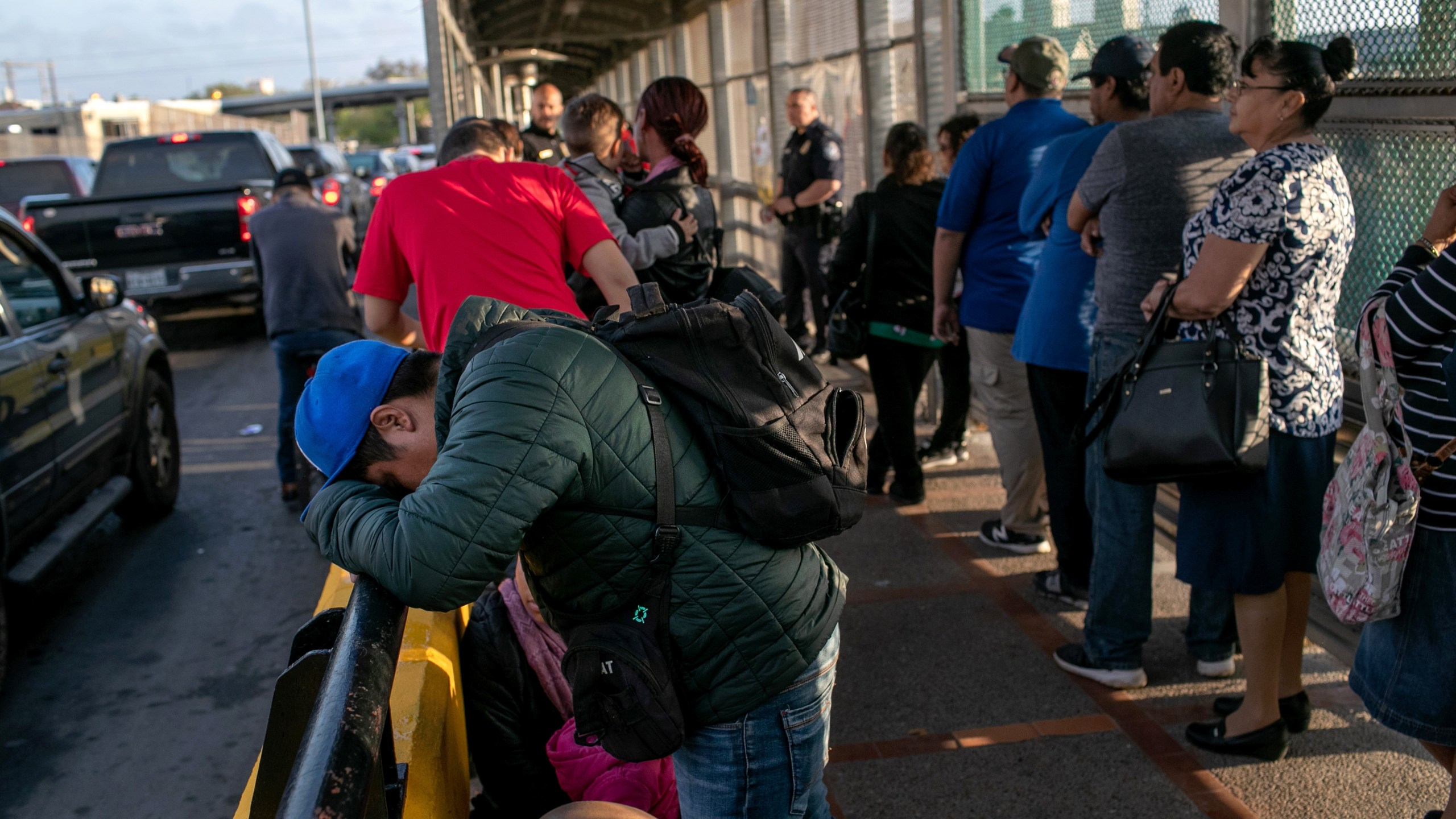 A Mexican asylum seeker waits with his family on the international bridge from Mexico to the United States on Dec. 09, 2019, next to the border town of Matamoros, Mexico. (Credit: John Moore/Getty Images)
