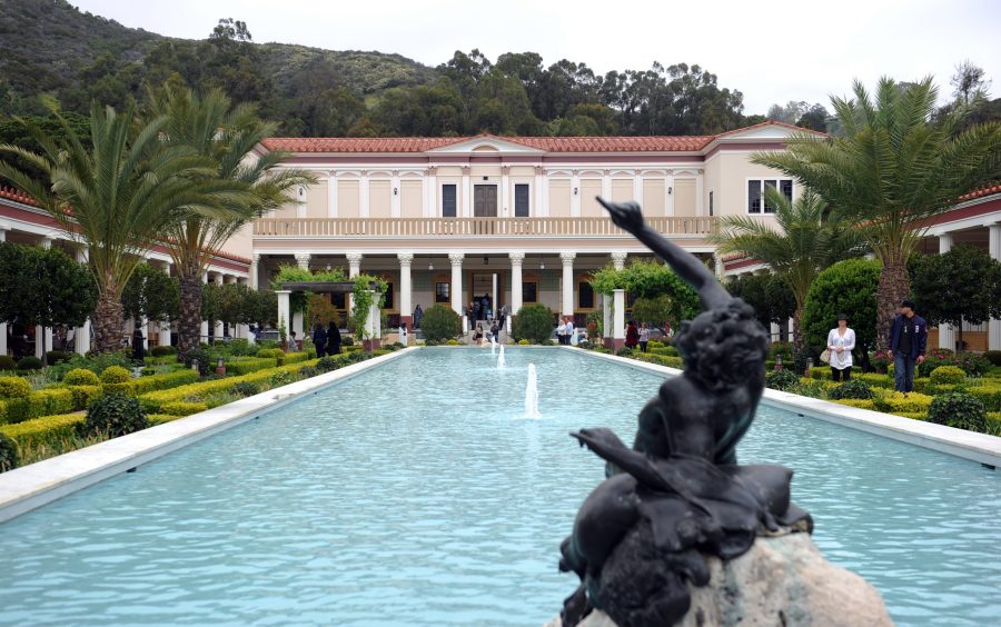 Visitors enjoy the garden at the Getty Villa Museum in Malibu on April 18, 2011. (Credit: GABRIEL BOUYS/AFP via Getty Images)