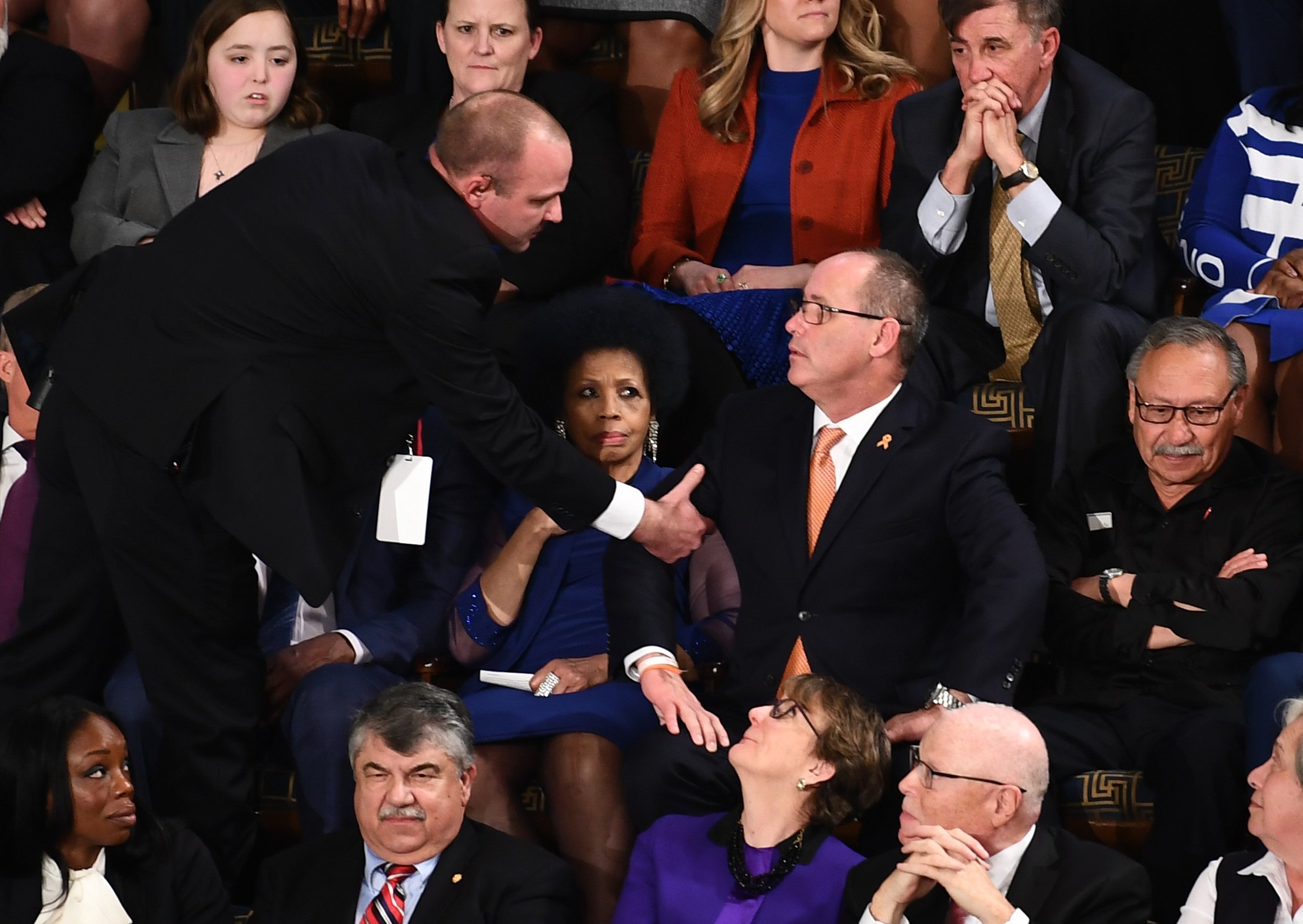Fred Guttenberg (C), who lost his 14-year-old daughter in the Parkland, Florida, school shooting is removed after yelling during the State of the Union address at the US Capitol in Washington, DC, on February 4, 2020. (Credit: BRENDAN SMIALOWSKI/AFP via Getty Images)