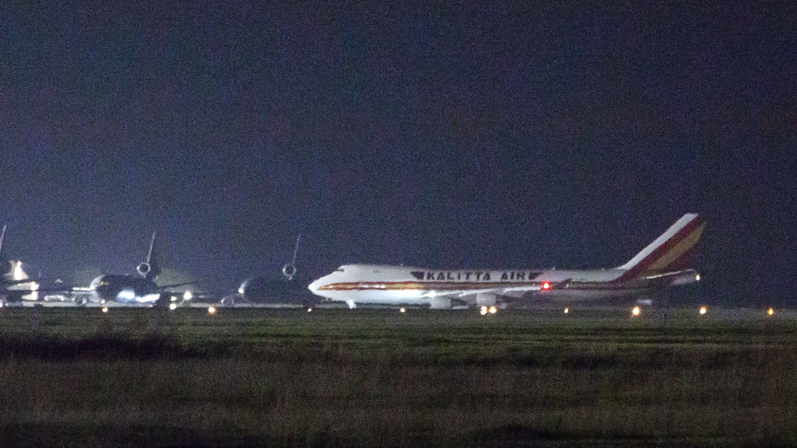 A plane carrying American passengers, who were recently released from the Diamond Princess cruise ship in Japan, arrives at Travis Air Force Base in Northern California on Feb. 16, 2020. (Credit: BRITTANY HOSEA-SMALL/AFP via Getty Images)