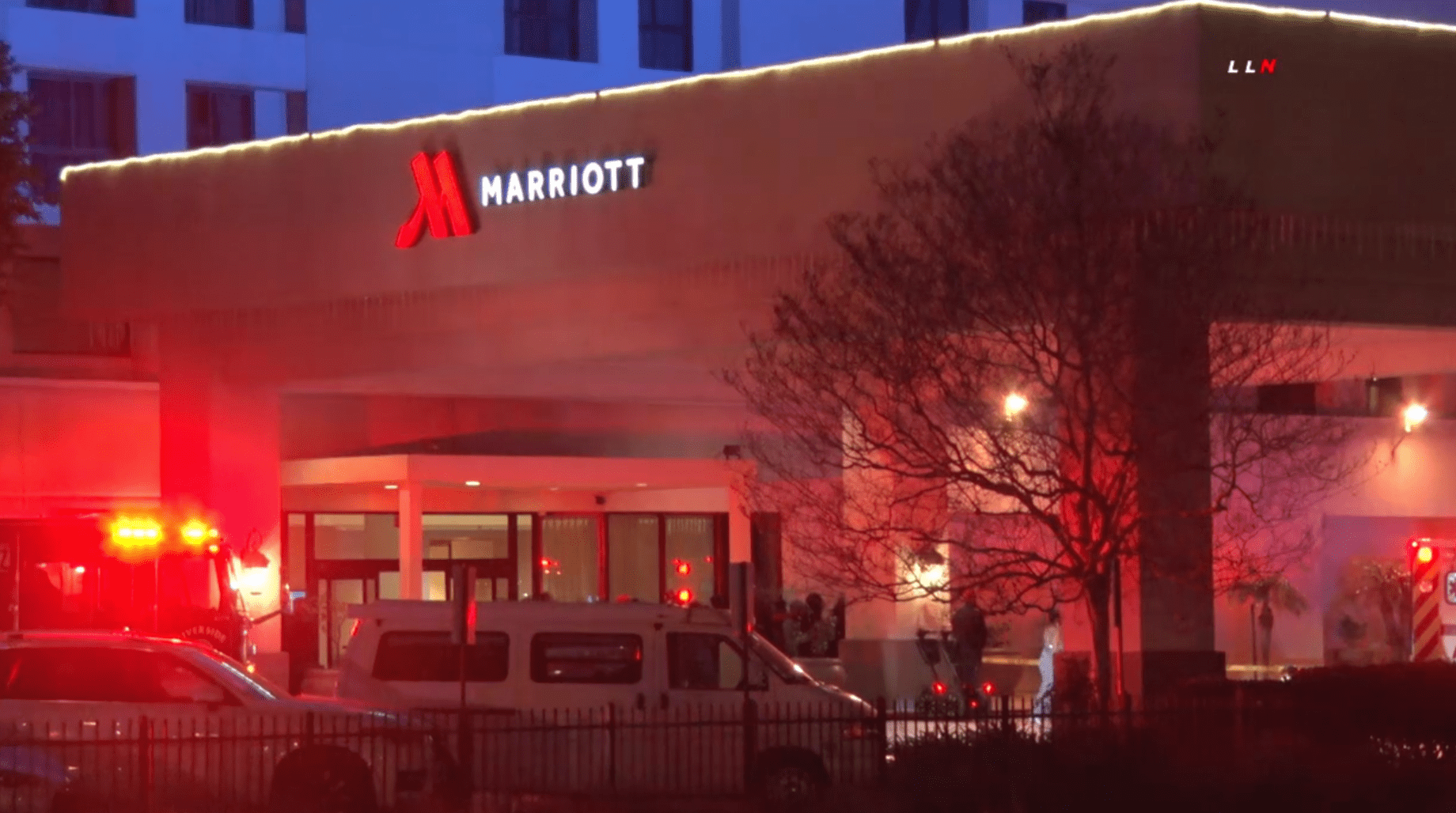 An ambulance is seen outside the the Marriott Riverside at the Convention Center, where a deadly shooting occurred on Feb. 14, 2020. (Credit: Loudlabs)