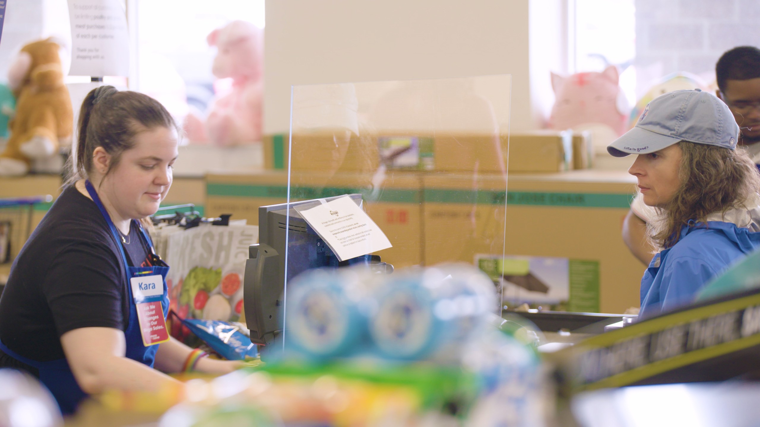 A sneeze guard is seen at a checkout lane at Kroger in this photo provided by the company.
