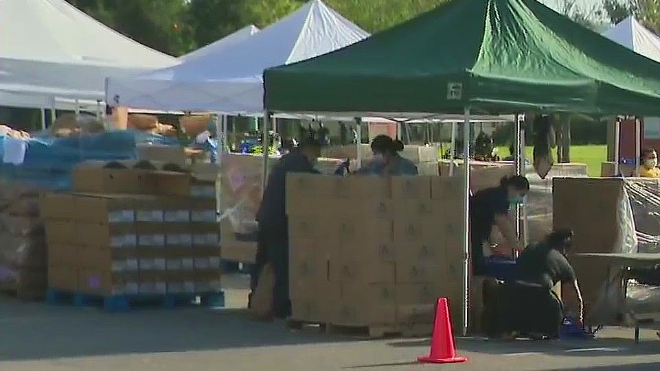 Volunteers prepare to distribute food at the East Los Angeles Civic Center on April 21, 2020. (KTLA)