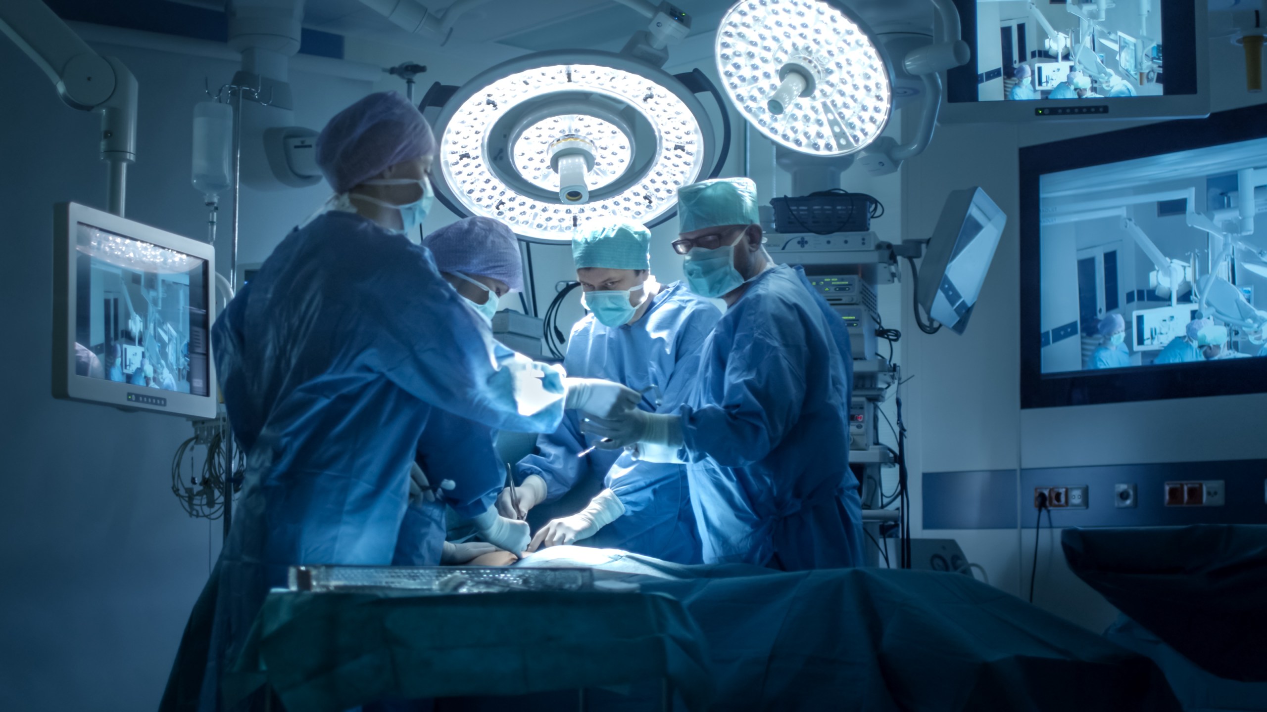 In this file photo, a medical team performs surgery in an operating room. (iStock/Getty Images Plus)