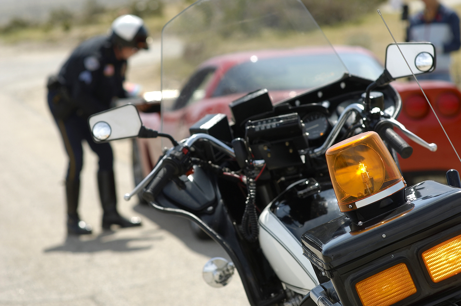 A police officer is shown pulling a car over. (sirtravelalot/Shutterstock via CNN)