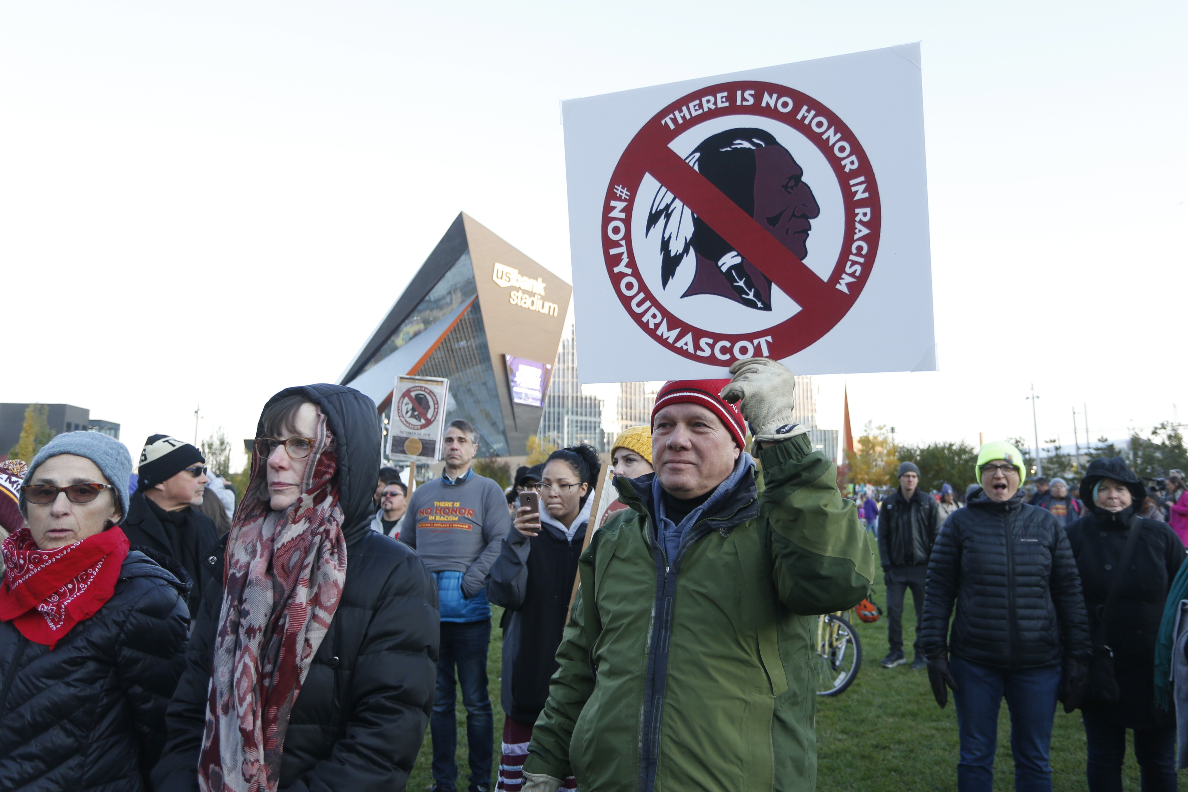 In this Oct. 24, 2019, file photo, Native American leaders protest against the Redskins team name outside U.S. Bank Stadium before an NFL football game between the Minnesota Vikings and the Washington Redskins in Minneapolis. (Bruce Kluckhohn/Associated Press)