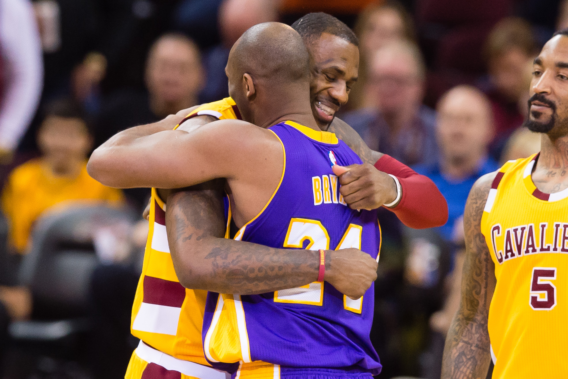 Kobe Bryant and LeBron James hug during the first half at Quicken Loans Arena on Feb. 10, 2016, in Cleveland, Ohio. (Jason Miller/Getty Images via CNN)