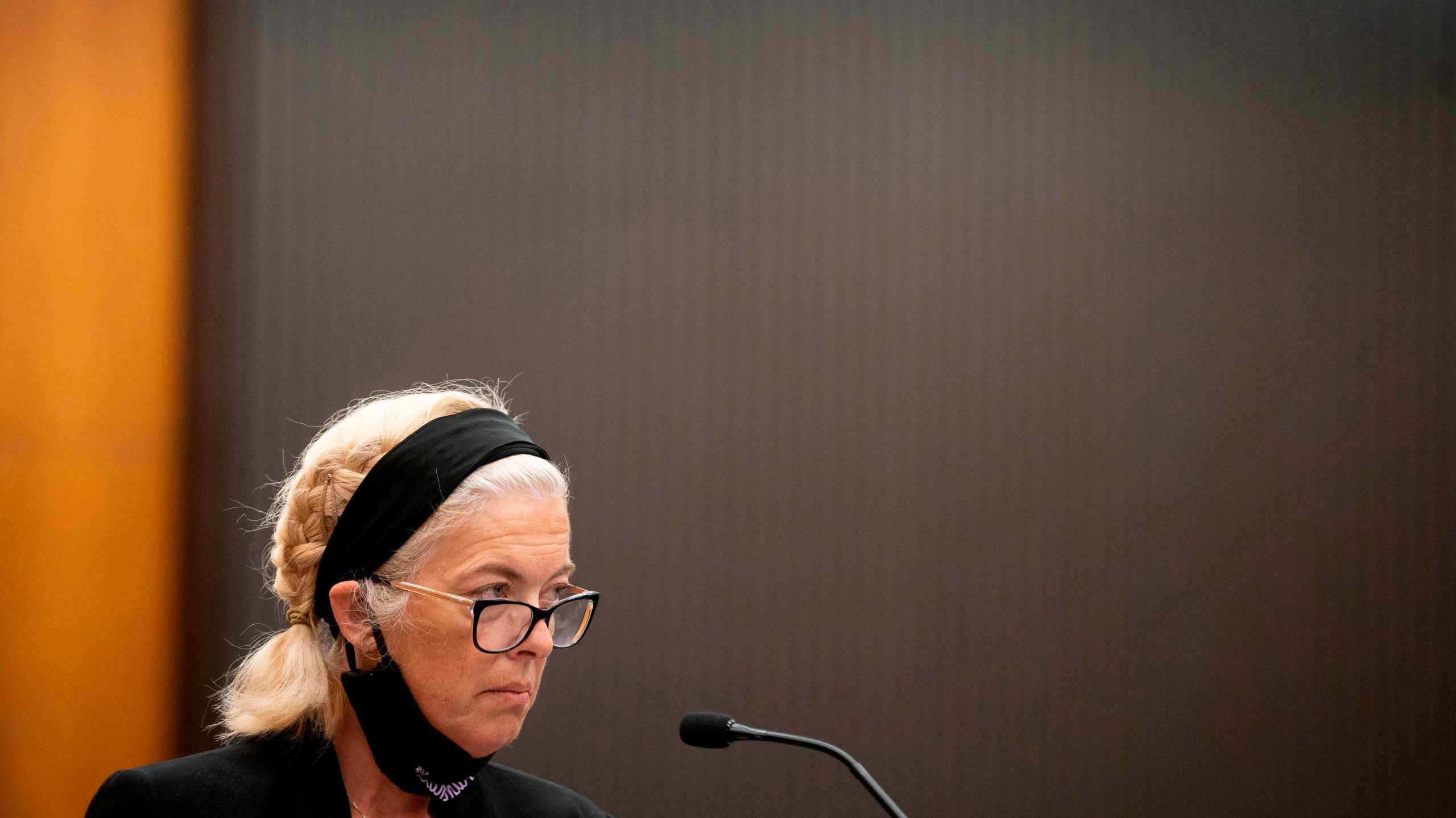 Patti Cosper, the daughter of rape survivor Patricia Murphy read a statement on her mother's behalf and then showed Joseph James DeAngelo the middle finger during the first day of victim impact statements at the Gordon D. Schaber Sacramento County Courthouse on Aug. 18, 2020, in Sacramento. (SANTIAGO MEJIA/POOL/AFP via Getty Images)