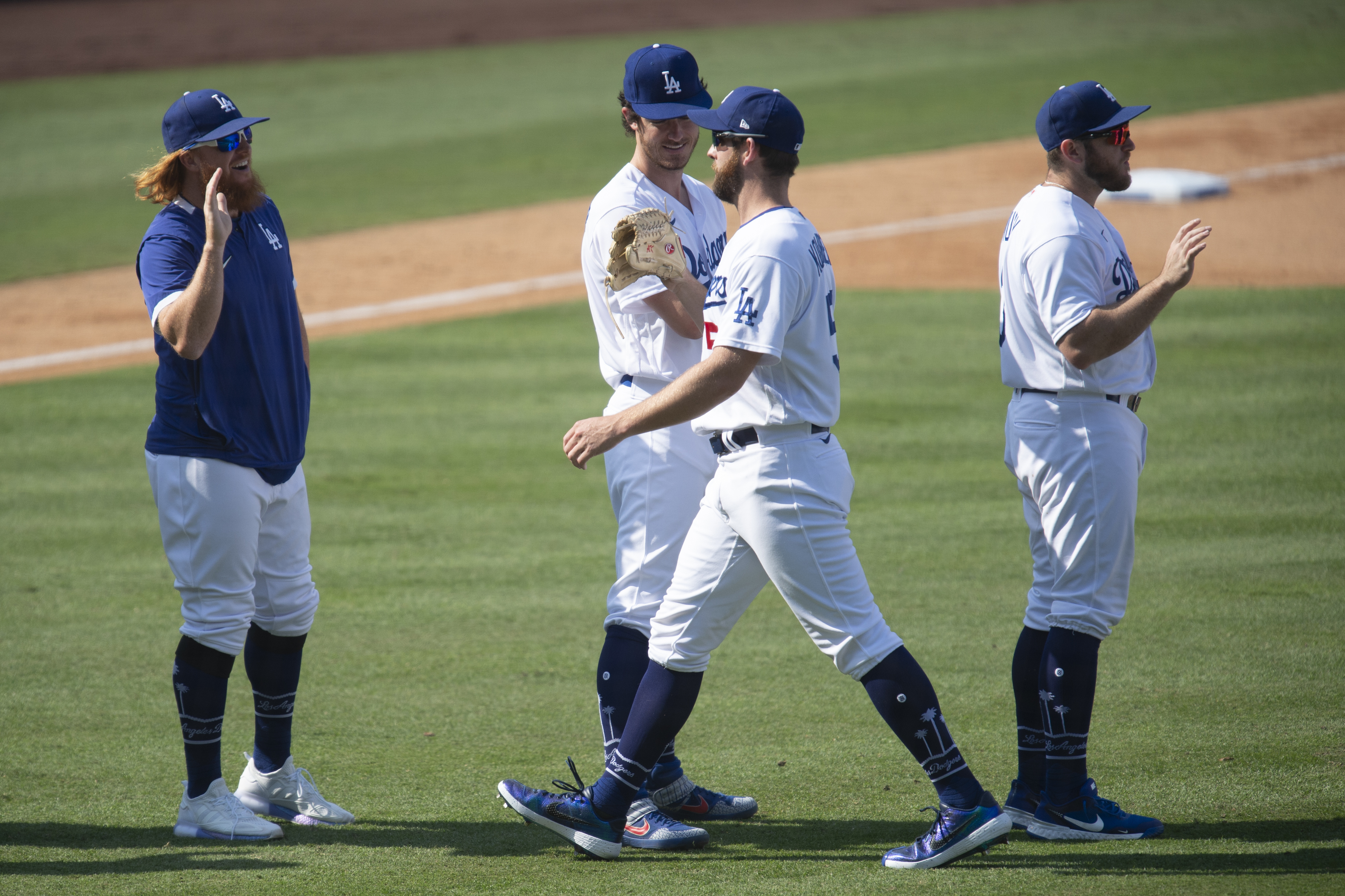 The Los Angeles Dodgers celebrate a 5-0 win over the Los Angeles Angels in a baseball game in Los Angeles, Sunday, Sept. 27, 2020. (AP Photo/Kyusung Gong)