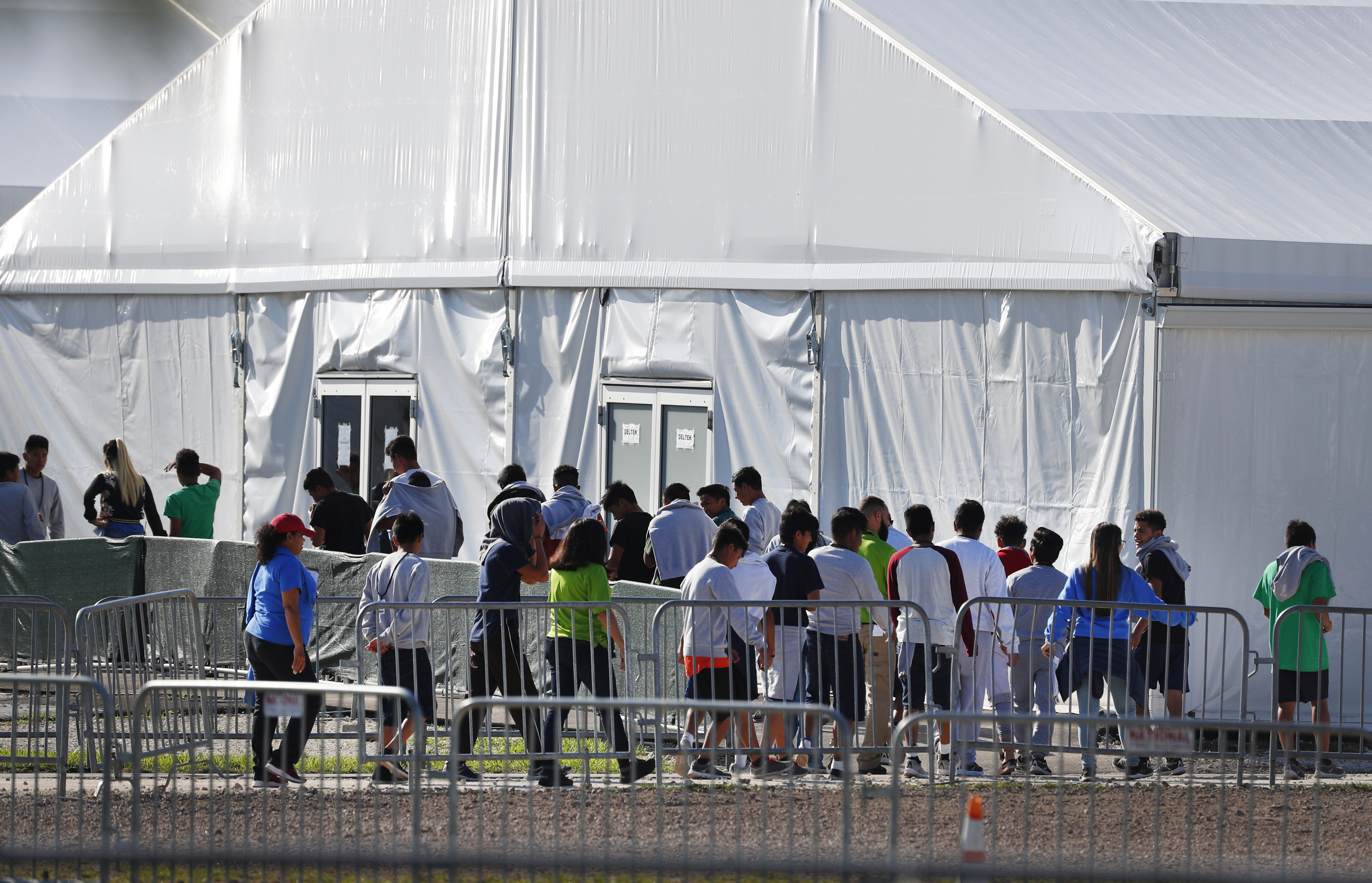 Children line up to enter a tent at the Homestead Temporary Shelter for Unaccompanied Children in Homestead, Florida, on Feb. 19, 2019. (Wilfredo Lee / Associated Press)