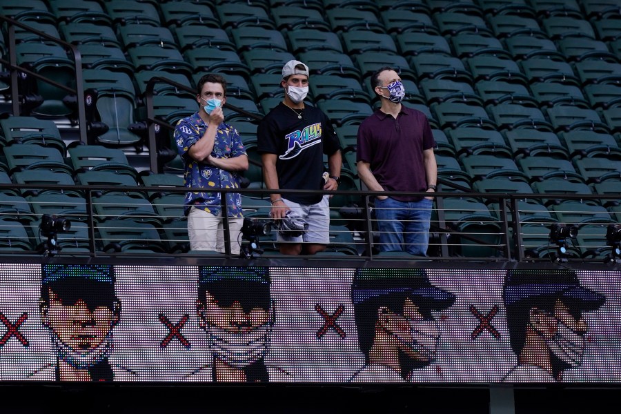 Fans watch batting practice before Game 1 of the baseball World Series between the Los Angeles Dodgers and the Tampa Bay Rays on Oct. 20, 2020, in Arlington, Texas. (AP Photo/Eric Gay)