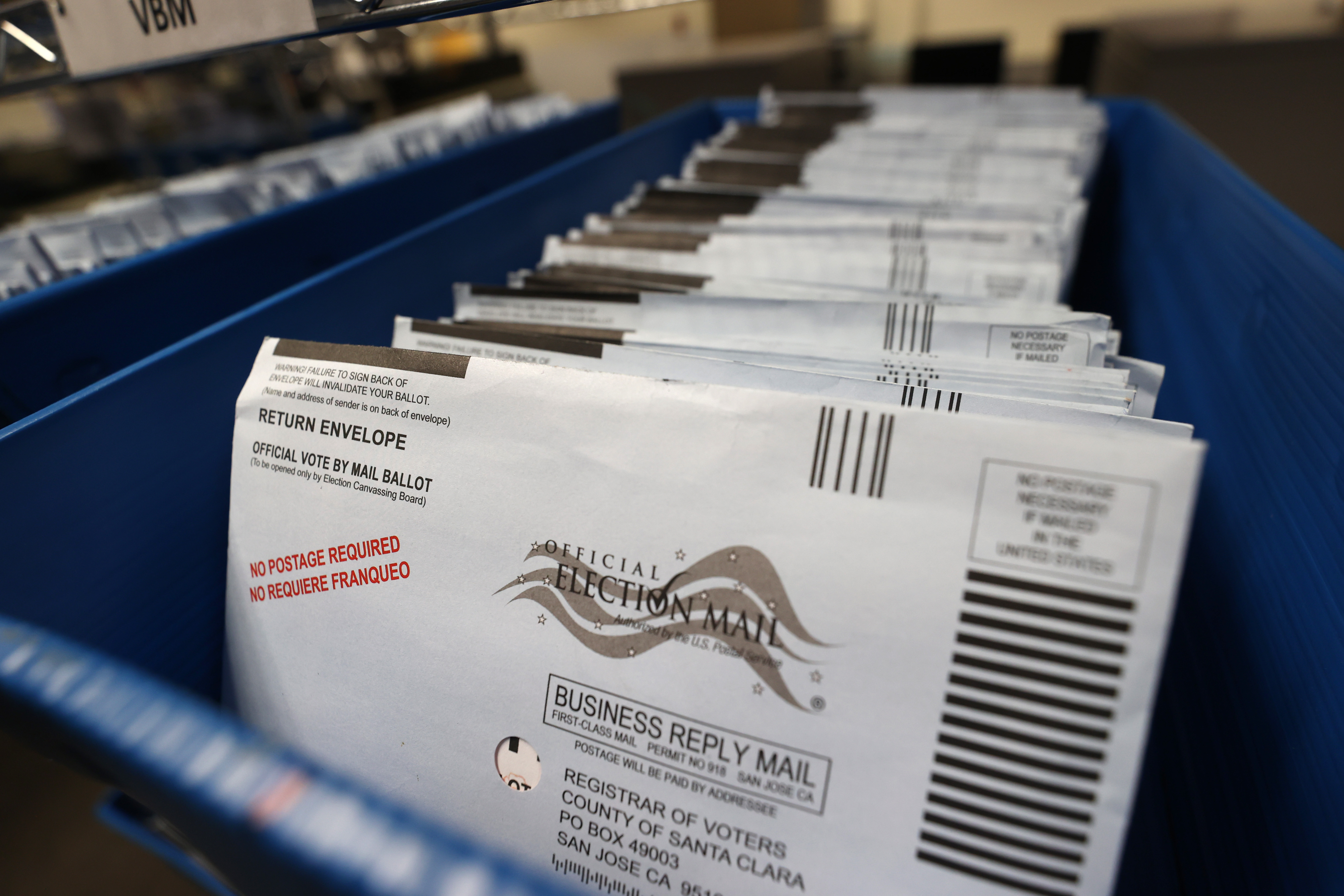 Mail-in ballots sit in trays before being sorted at the Santa Clara County registrar of voters office on Oct. 13, 2020 in San Jose, California. (Justin Sullivan/Getty Images)