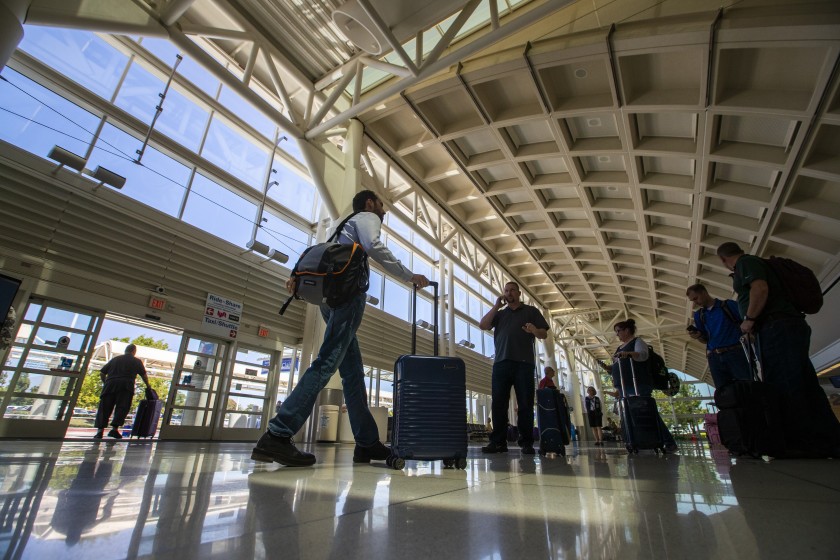 People walk through Ontario International Airport in August 2019. Strong Santa Ana winds have forced the closure of all runways at the airport. (Allen J. Schaben/Los Angeles Times)People walk through Ontario International Airport in August 2019. Strong Santa Ana winds have forced the closure of all runways at the airport. (Allen J. Schaben/Los Angeles Times)