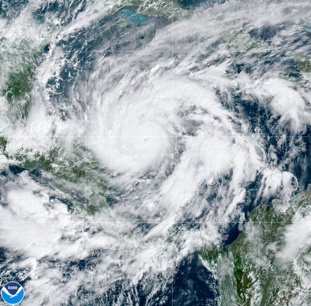 This GeoColor satellite image taken Monday, Nov. 2, 2020, at 1 p.m. EDT, and provided by NOAA, shows Hurricane Eta in the Gulf of Mexico approaching the border of Honduras and Nicaragua. (NOAA via AP)