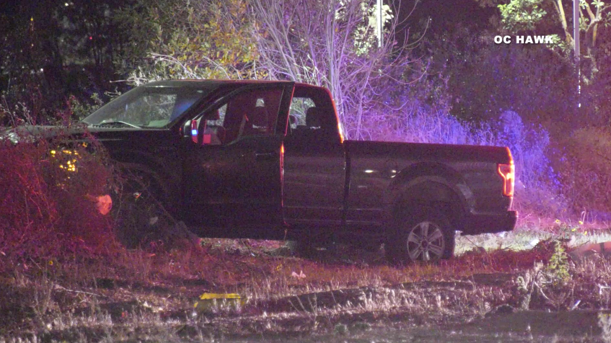 A pickup came to rest on the shoulder of the southbound 15 Freeway in the Ontario area after its driver was fatally shot on Dec. 14, 2020. (OC Hawk)