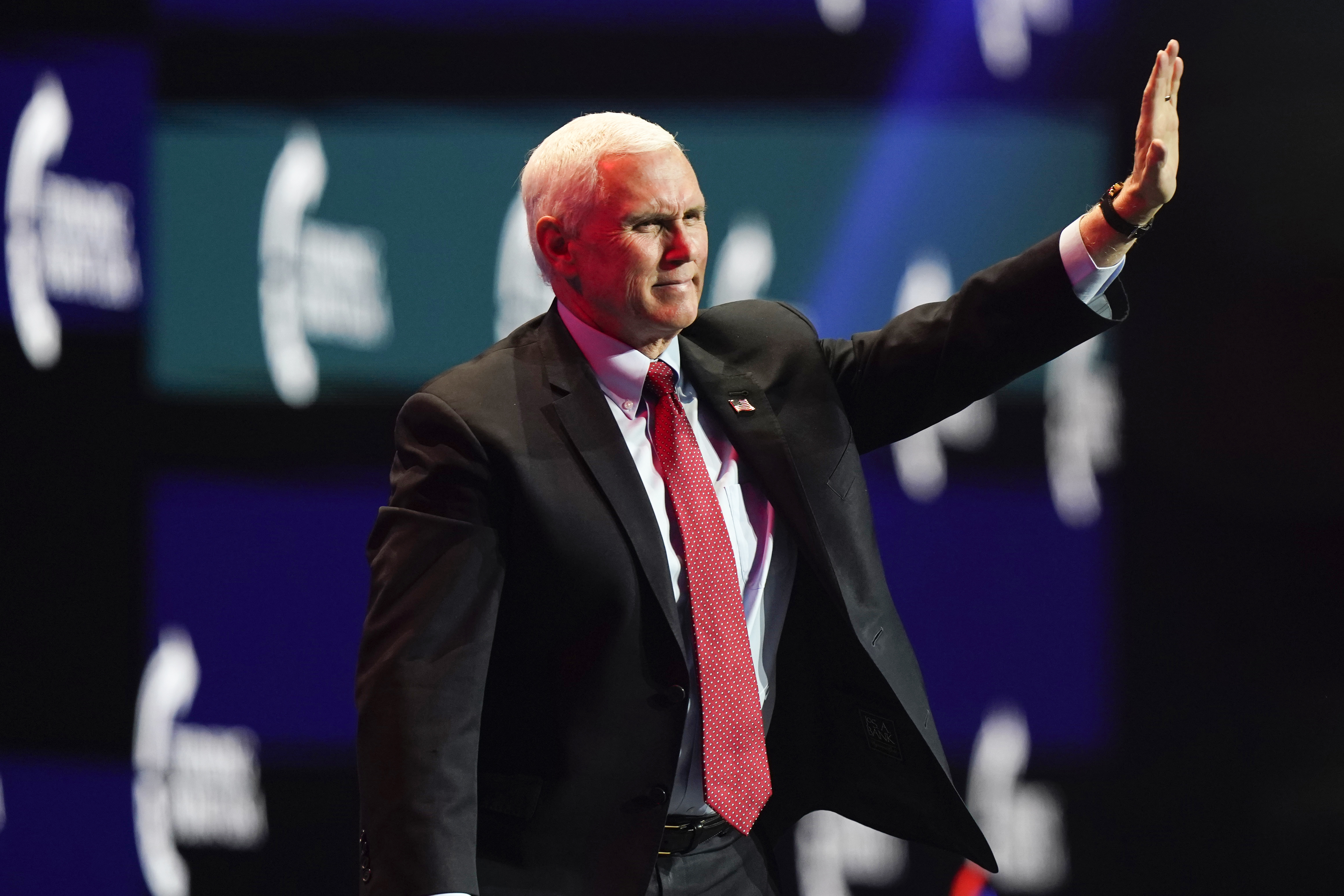 Vice President Mike Pence waves as he walks off the stage after speaking at the Turning Point USA Student Action Summit, Tuesday, Dec. 22, 2020, in West Palm Beach, Fla. (Lynne Sladky/AP Photo)