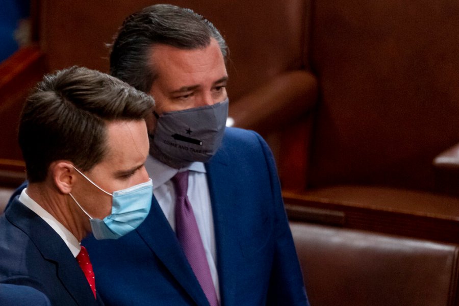 Sen. Josh Hawley, R-Mo., left, and Sen. Ted Cruz, R-Texas, right, speak after Republicans objected to certifying the Electoral College votes from Arizona, during a joint session of the House and Senate to confirm the electoral votes cast in November's election, at the Capitol, Wednesday, Jan 6, 2021. (AP Photo/Andrew Harnik)