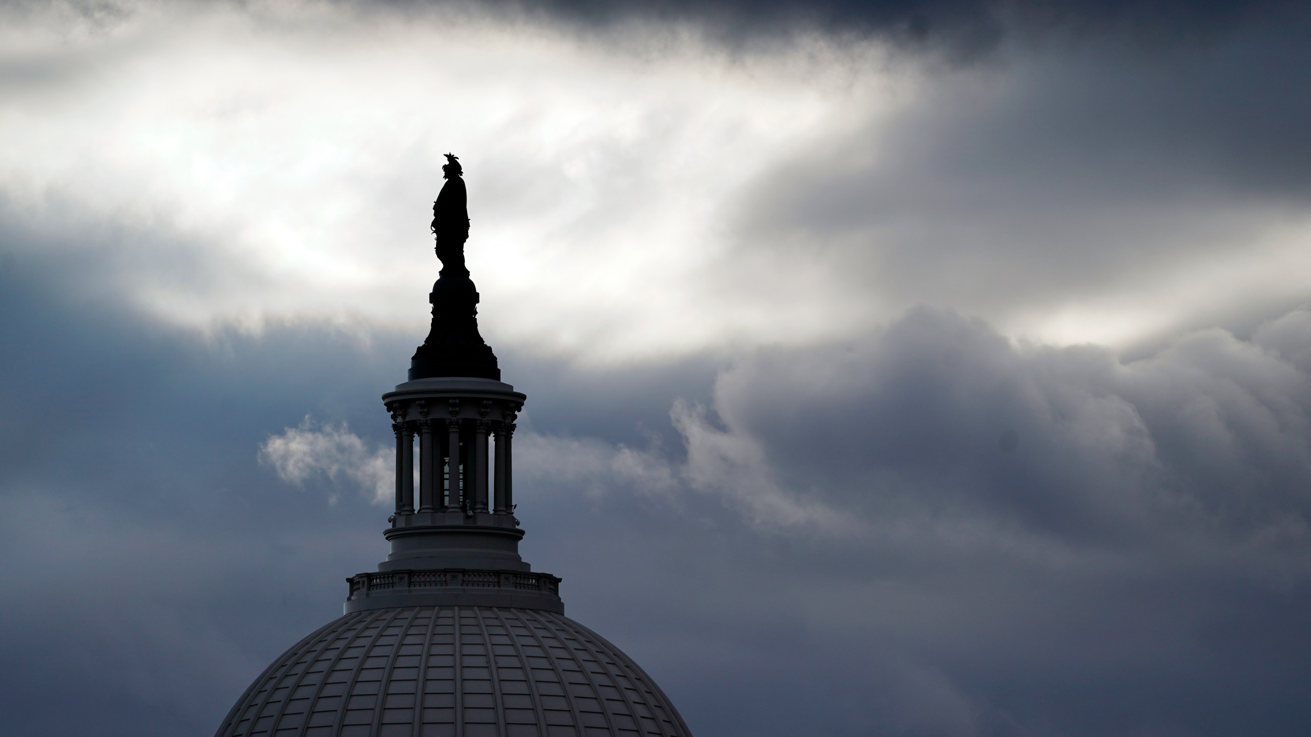 The bronze Statue of Freedom, by Thomas Crawford, is the crowning feature of the dome of the U.S. Capitol, shown ahead of the inauguration of President-elect Joe Biden and Vice President-elect Kamala Harris, Sunday, Jan. 17, 2021, in Washington. (AP Photo/Julio Cortez)