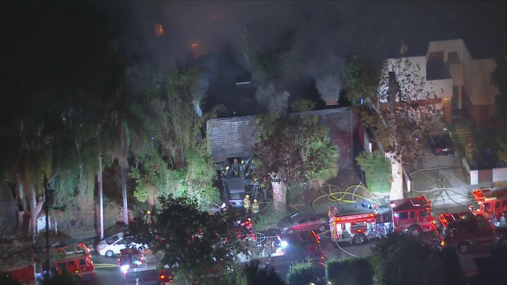 Firefighters battle a blaze in Hollywood Hills West on Jan. 8, 2020. (KTLA)