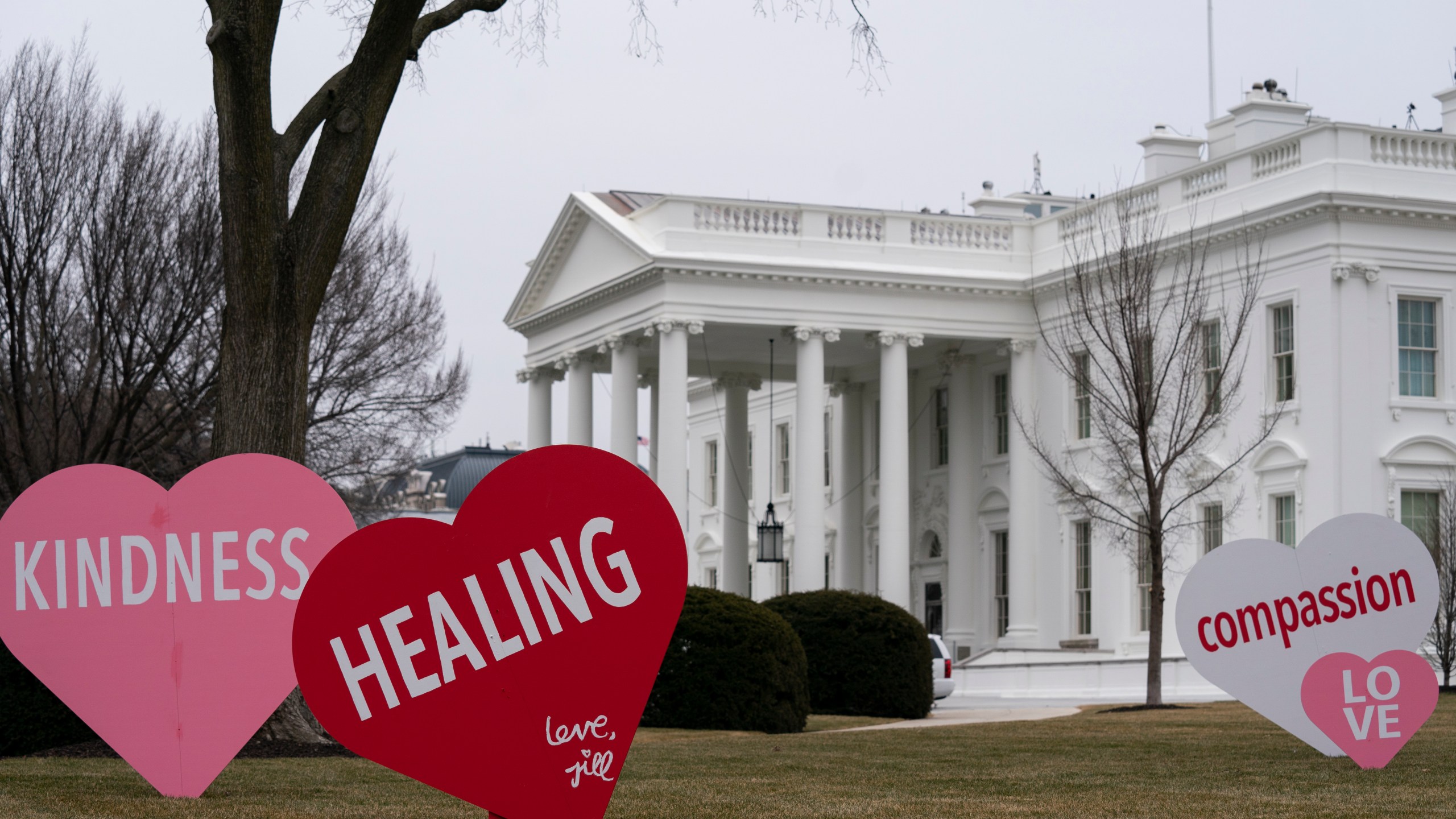A Valentine's Day decoration, signed by first lady Jill Biden, sits on the North Lawn of the White House, Friday, Feb. 12, 2021, in Washington. (AP Photo/Evan Vucci)