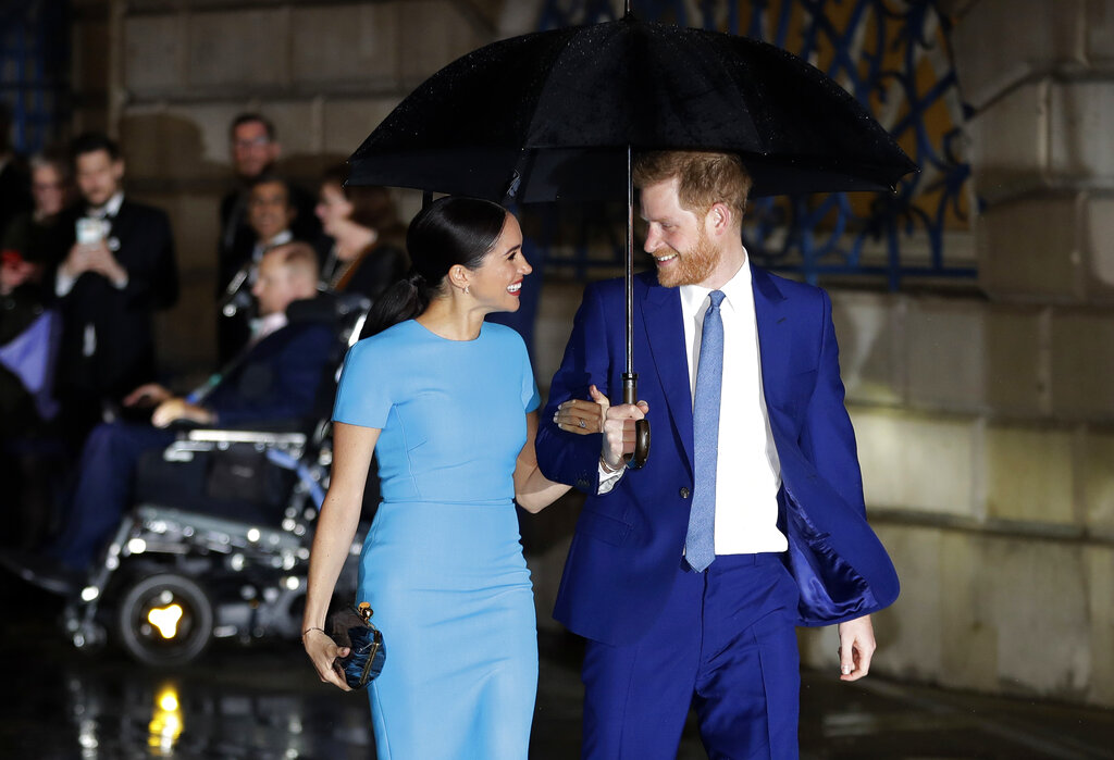 Britain's Prince Harry and Meghan arrive at the annual Endeavour Fund Awards in London, Thursday, March 5, 2020. (AP Photo/Kirsty Wigglesworth, file)