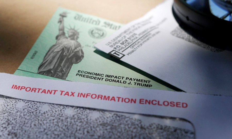 This April 23, 2020, file photo shows a stimulus check issued by the IRS to help combat the adverse economic effects of the COVID-19 outbreak, in San Antonio, Texas. (AP Photo/Eric Gay, File)