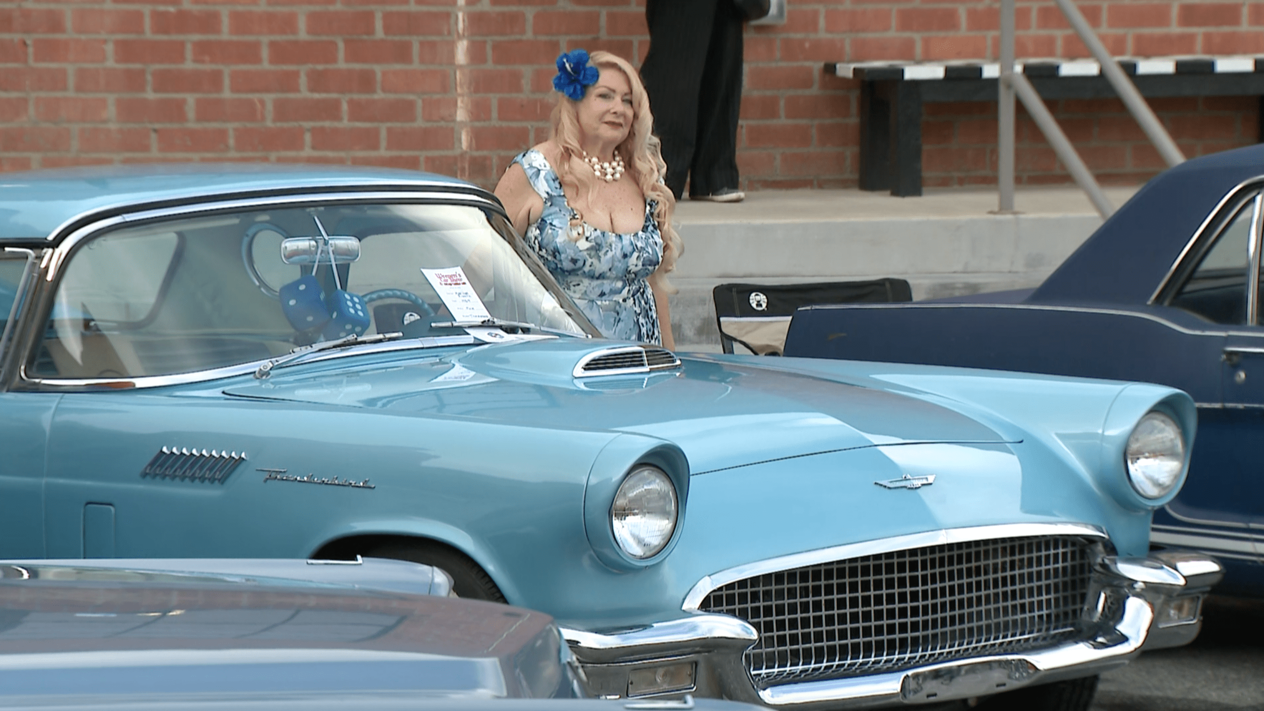 A participant in the Automobile Driving Museum’s women’s car show is seen on March 20, 2021. (KTLA)