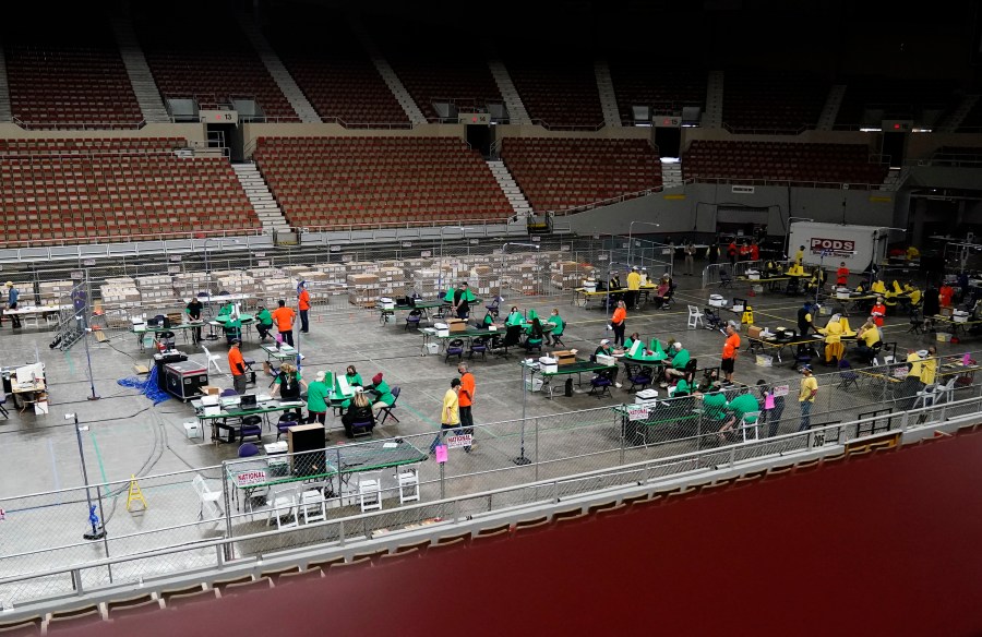 Maricopa County ballots cast in the 2020 general election are being examined and recounted by contractors working for Florida-based company, Cyber Ninjas, who was hired by the Arizona State Senate at Veterans Memorial Coliseum in Phoenix, Thursday, April 29, 2021. (Rob Schumacher/The Arizona Republic via AP, Pool)
