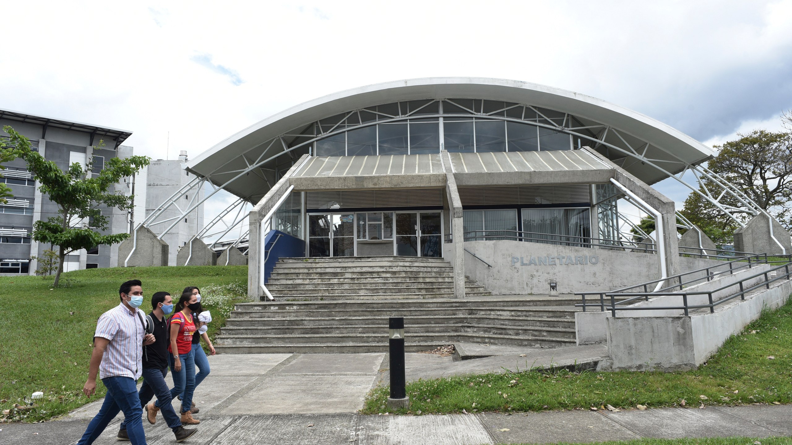 Students walks past the Solar Astronomical Observatory in San Jose, Costa Rica, Friday, April 30, 2021. Costa Rica approved a law creating a space agency on Feb. 18. (AP Photo/Carlos Gonzalez)