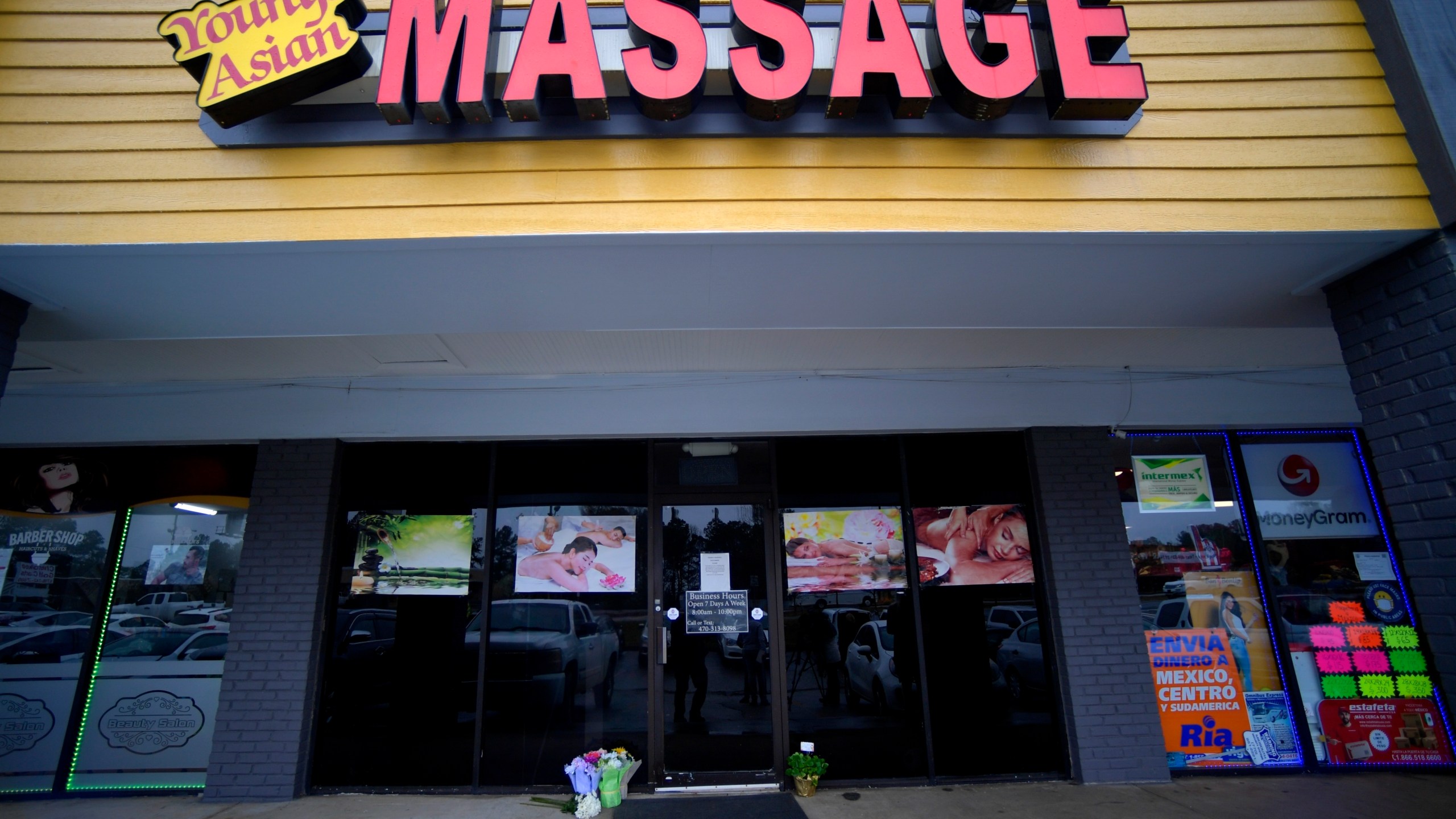 A make-shift memorial is seen on March 17, 2021, outside a business where a multiple fatal shooting occurred in Acworth, Ga. (Mike Stewart / Associated Press)